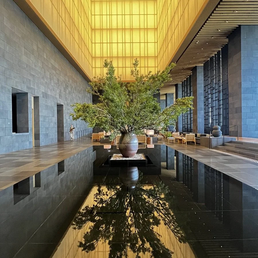 Aman Tokyo lobby with reflecting pool and illuminated lantern ceiling