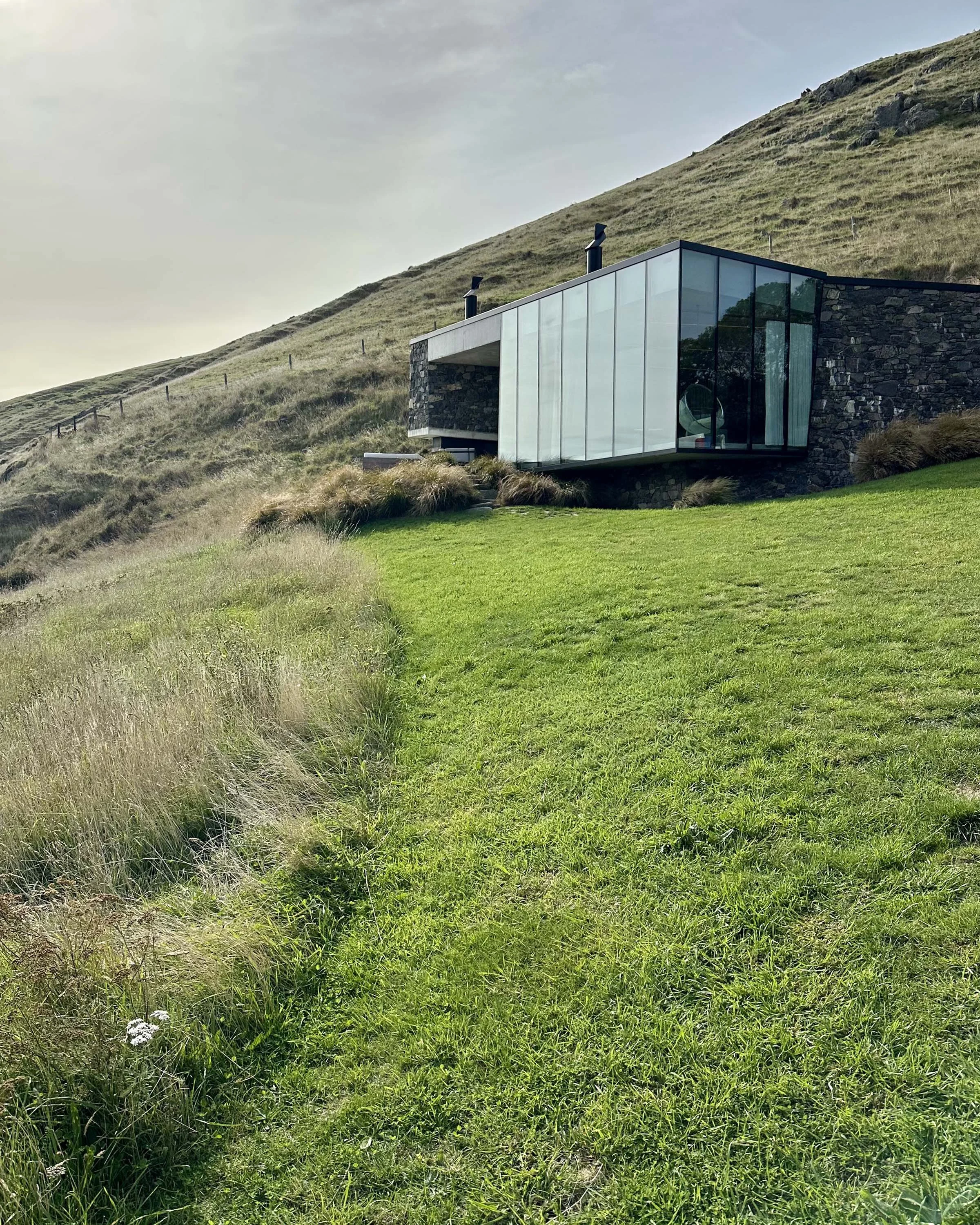 Remote luxury travel experience in New Zealand with helicopter-accessed landscapes