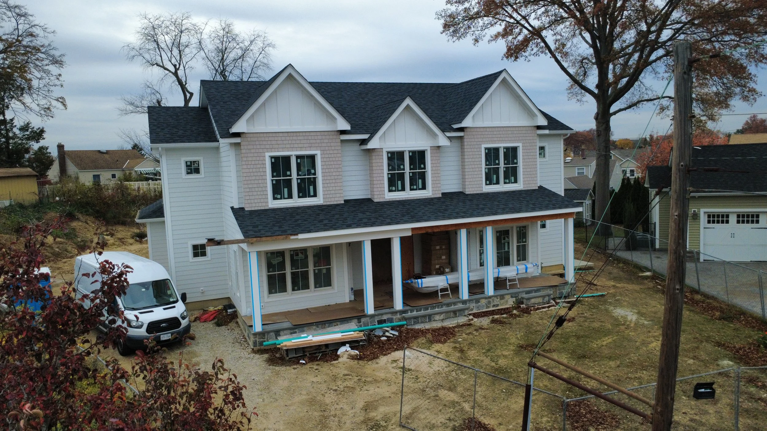 Custom home new construction in progress in Nassau County, NY designed by Americana Architects.