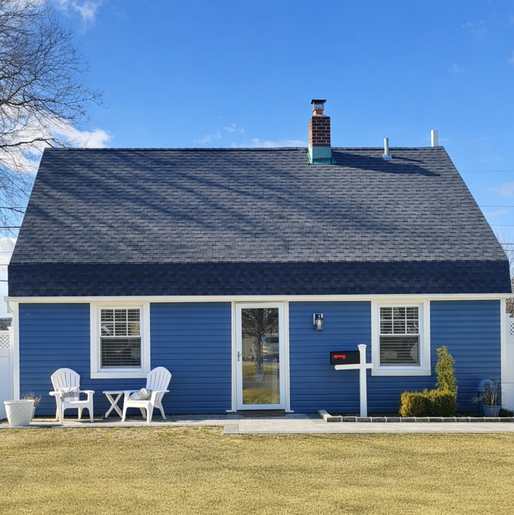 Original Levittown home prior to renovation and porch addition.