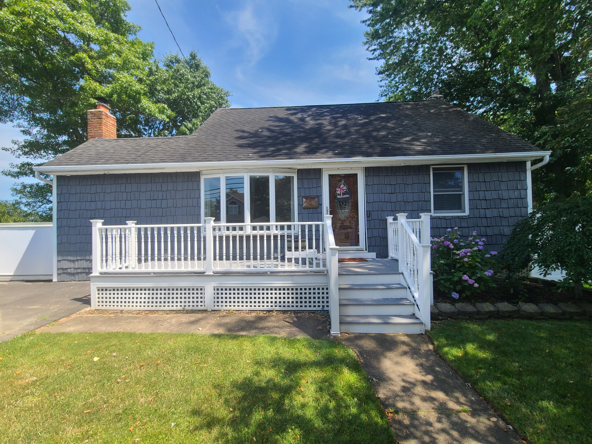 Original ranch-style home exterior prior to second floor addition and renovation by Americana Architects.