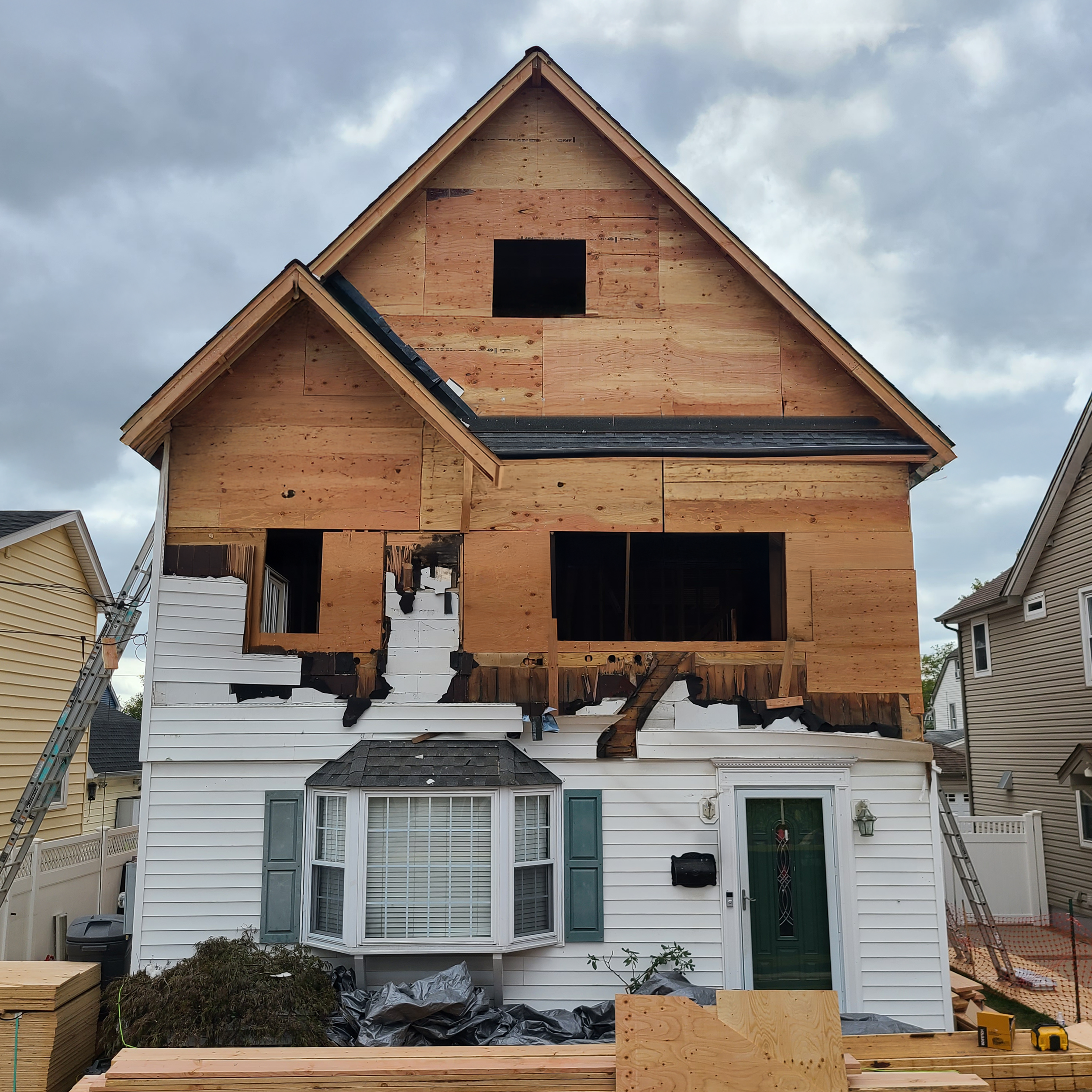 Second floor addition framing in progress on a Cape-style home in Williston Park, NY by Americana Architects.