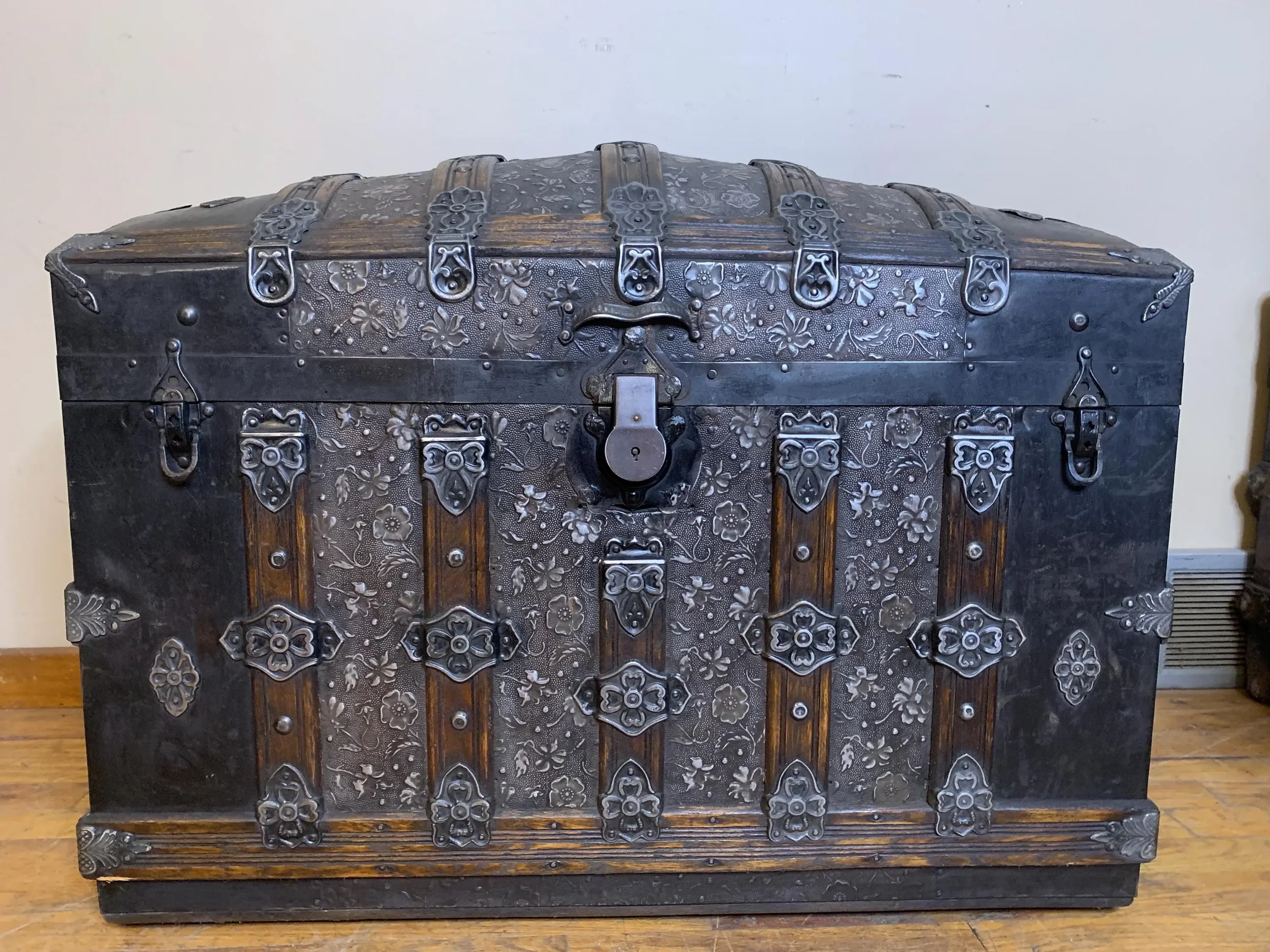 antique steamer trunk arch top with embossed tin