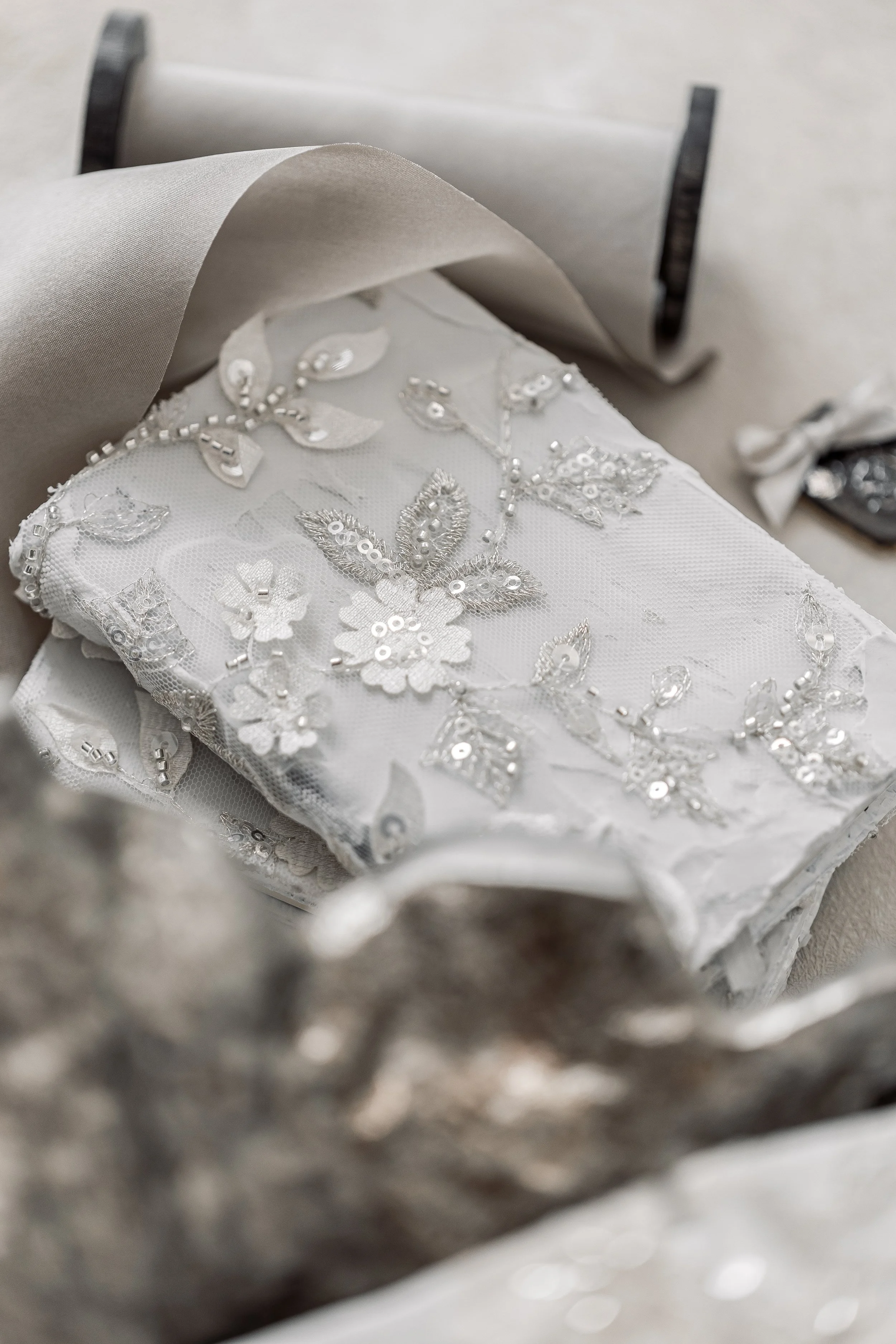 Vow books to match the texture of the invitation suite and other fabric embroidery throughout the rest of the entire event.