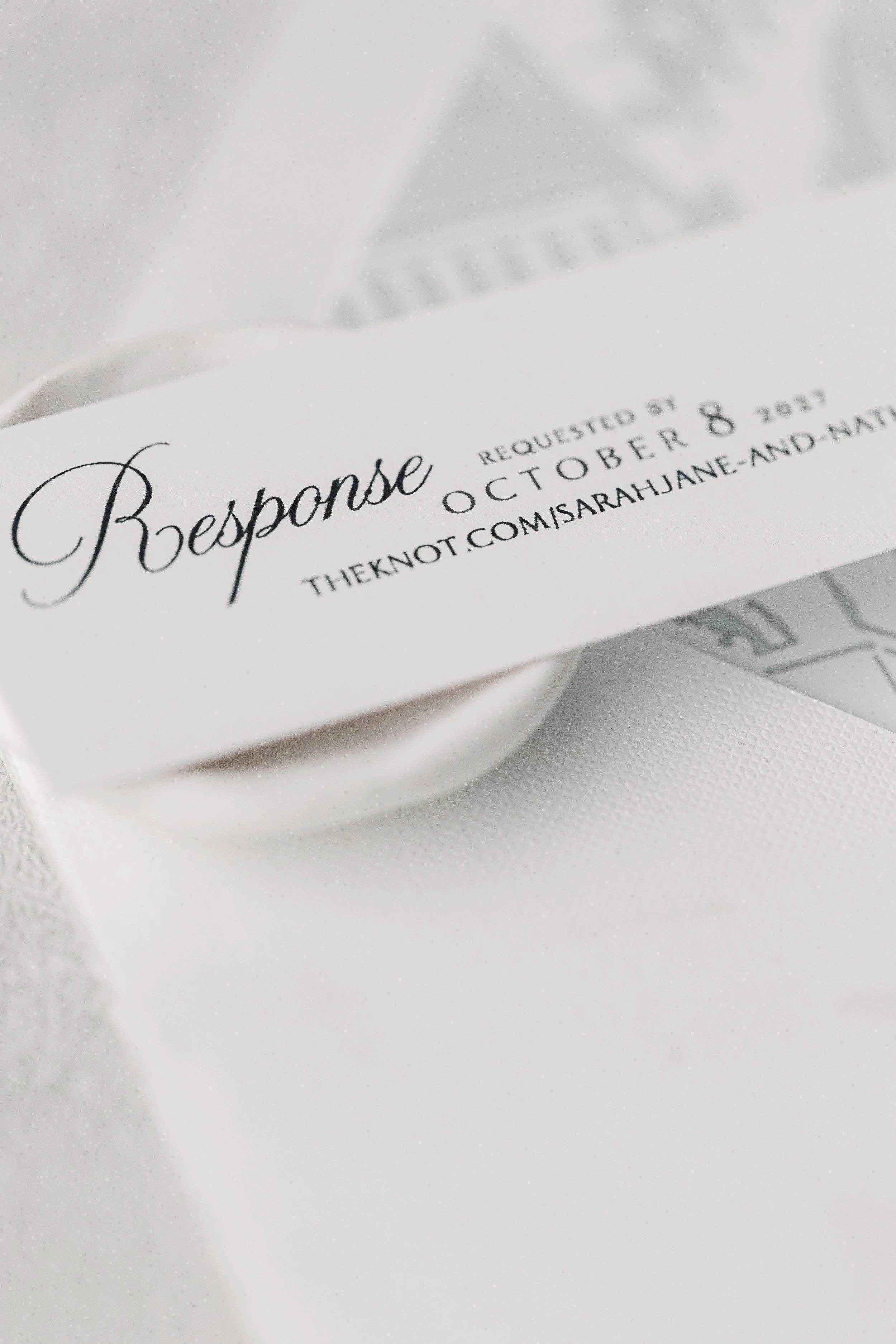 The response card gently directs guests to the couple’s wedding website, blending modern convenience with the suite’s elevated, cohesive design.