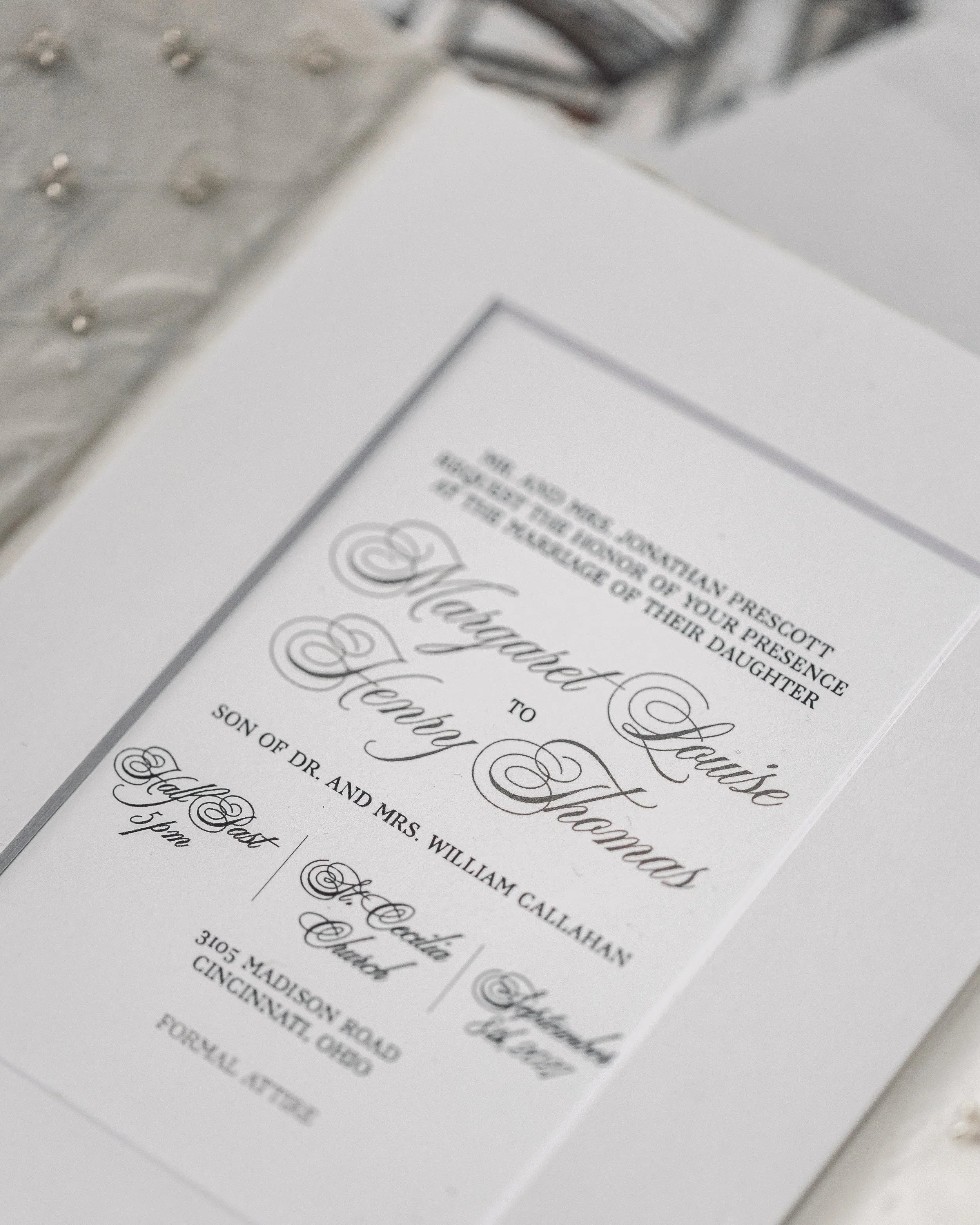 Black digital printing contrasts against the matte surface, paired with flowing script and complementary serif fonts.