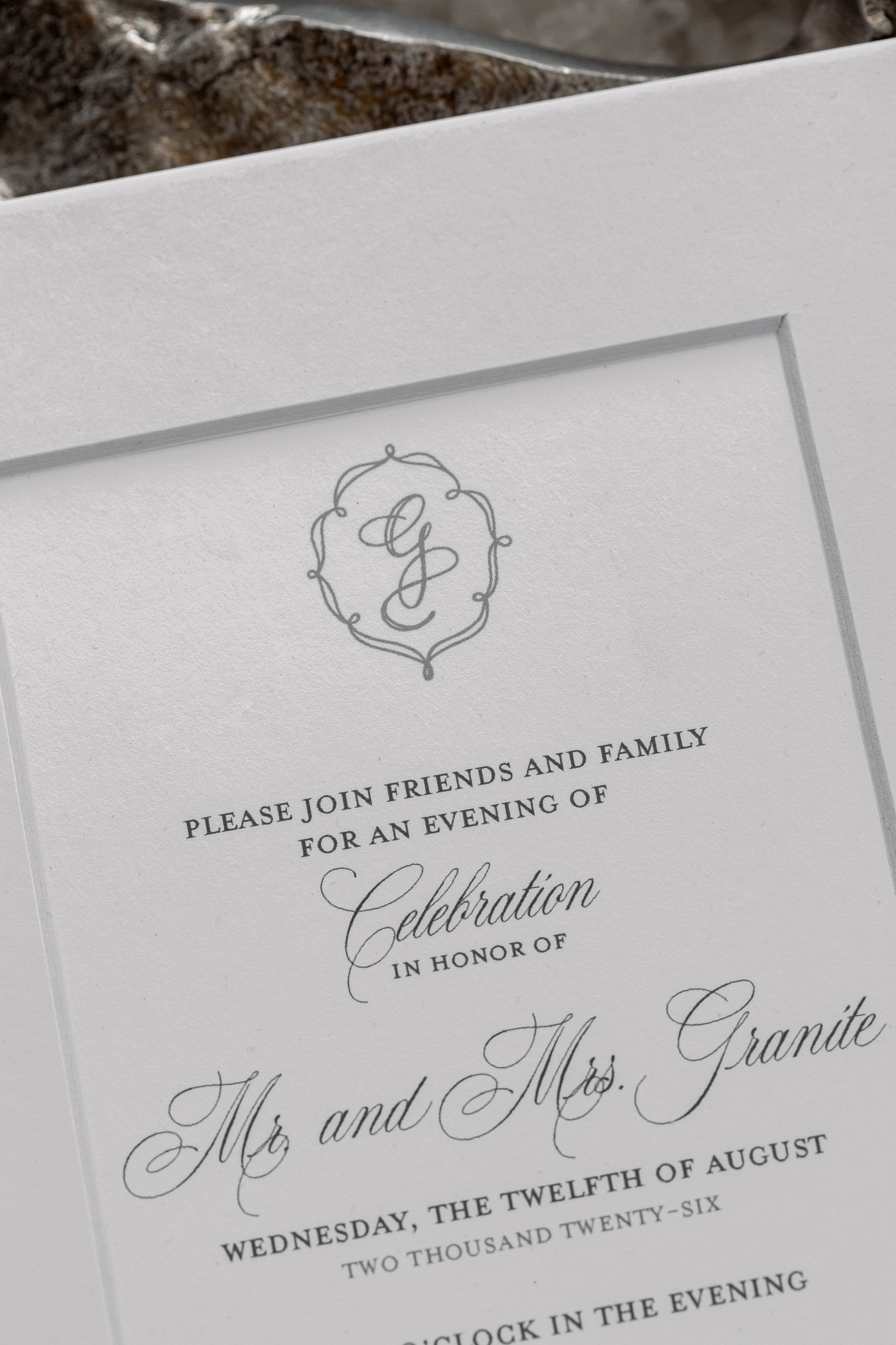 Digitally printed taupe grey ink is the perfect stark differentiator on this true white cardstock and mat.
