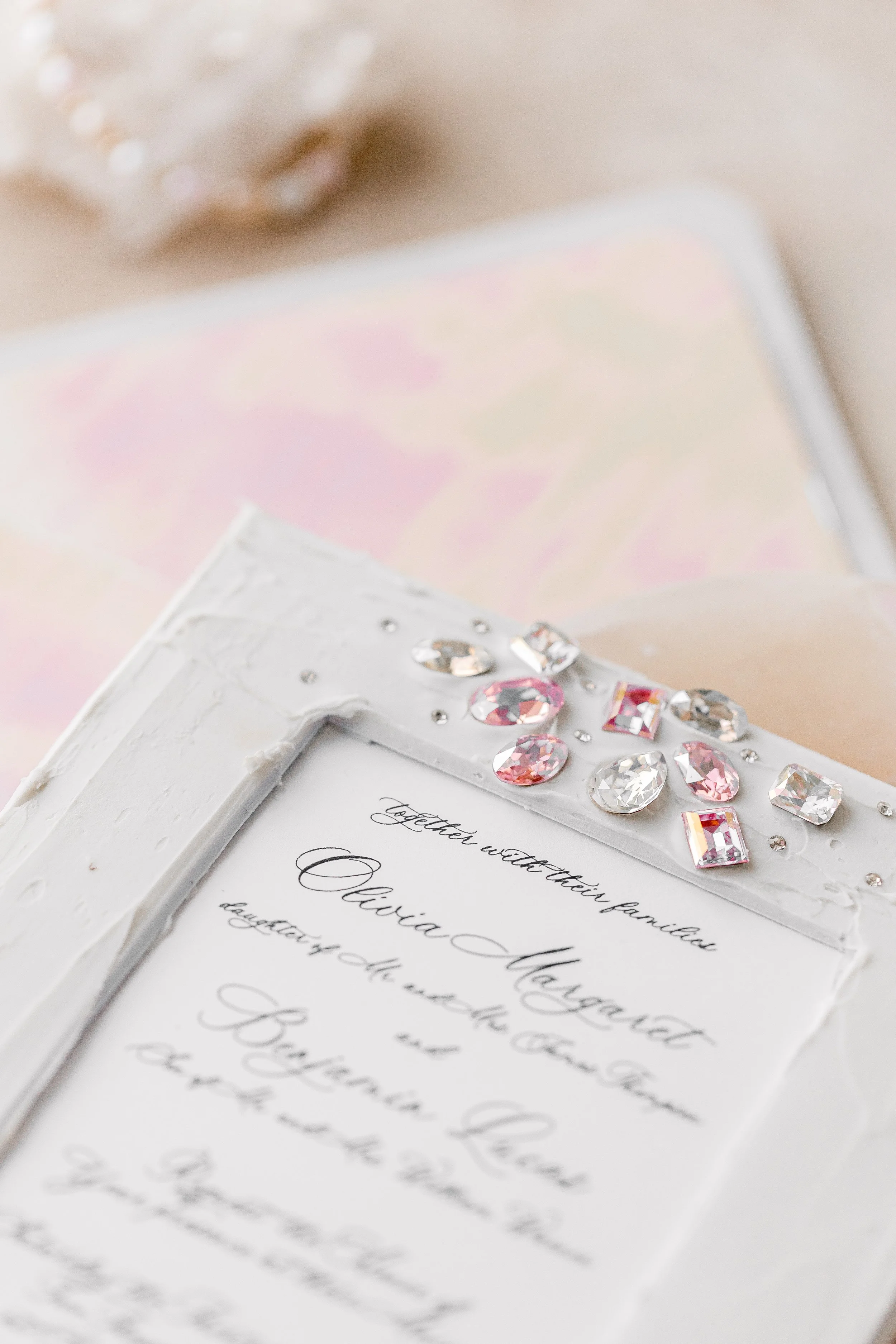 An iridescent liner adds a hidden shimmer, creating a delicate surprise when the envelope is opened.