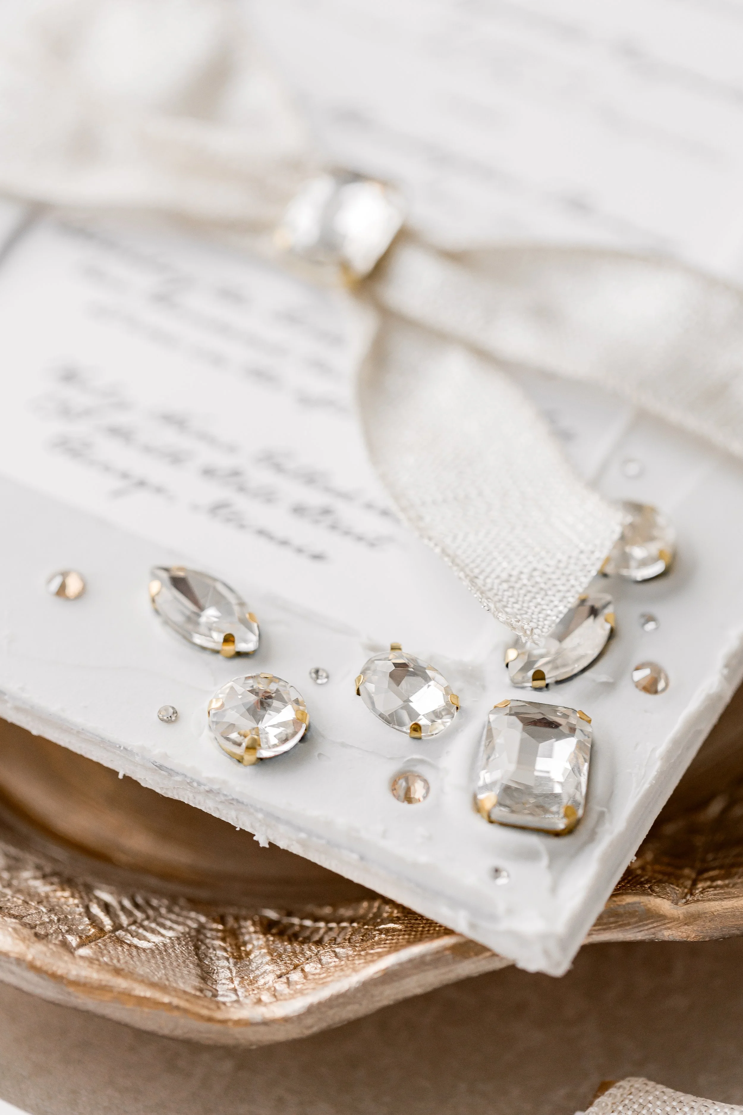A macro shot of the gold metal rhinestones with mini champagne accents, demonstrating the meticulous hand-placement and sparkling dimension.