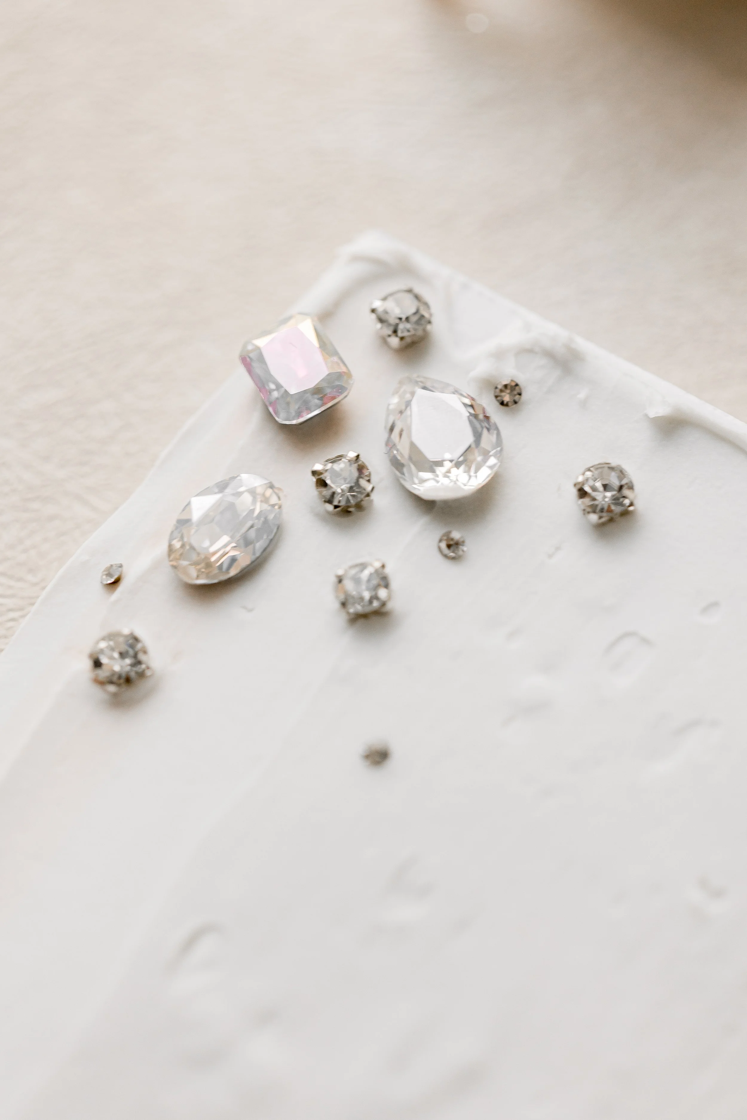 Each stone, from teardrop to princess cut, is placed with intention to catch the light and enhance the overall dimensionality of the design.