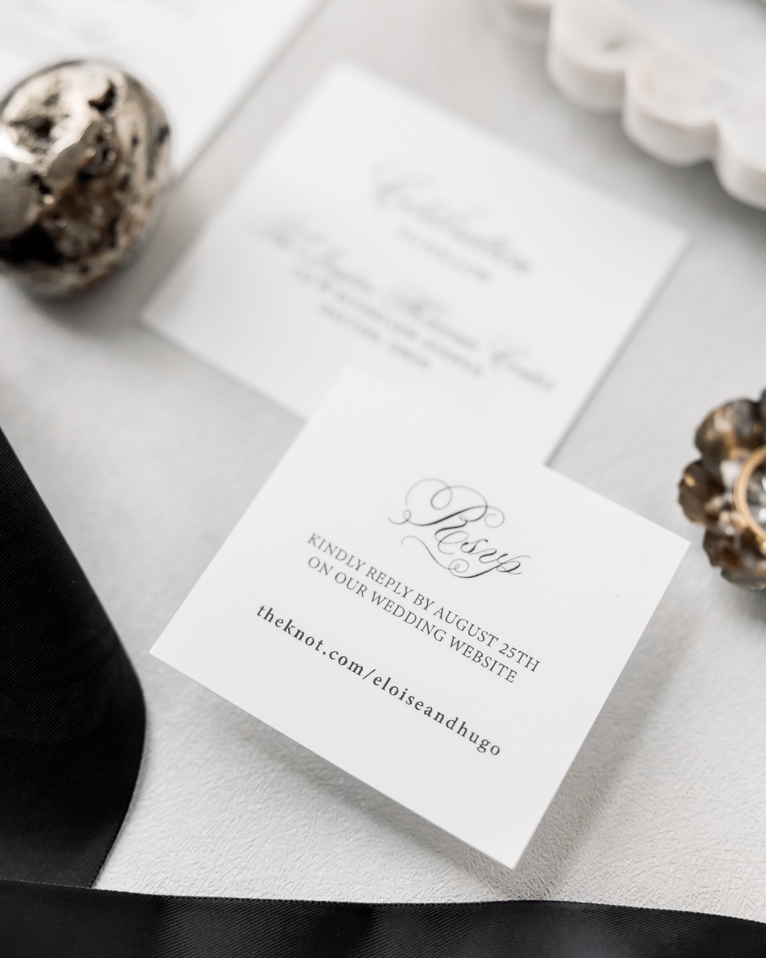 RSVP and welcome party inserts extend the suite’s tactile elegance, each layered with matte, beads, and subtle metallic shimmer to make even functional pieces feel ceremonial.