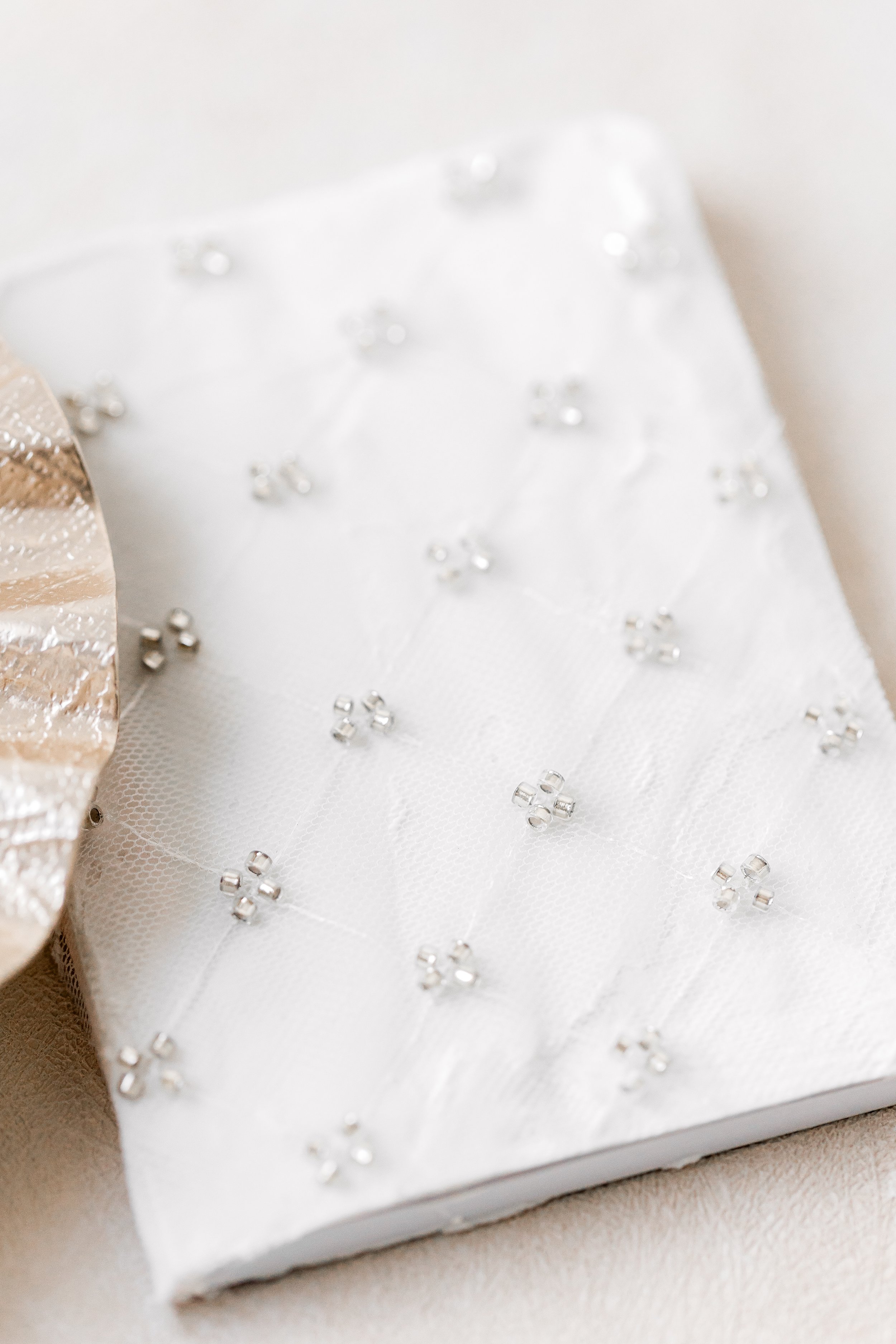 A second vow book in a complementary textile, thoughtfully designed to pair with the suite and available through the NOTE shop for couples drawn to layered, cohesive details.