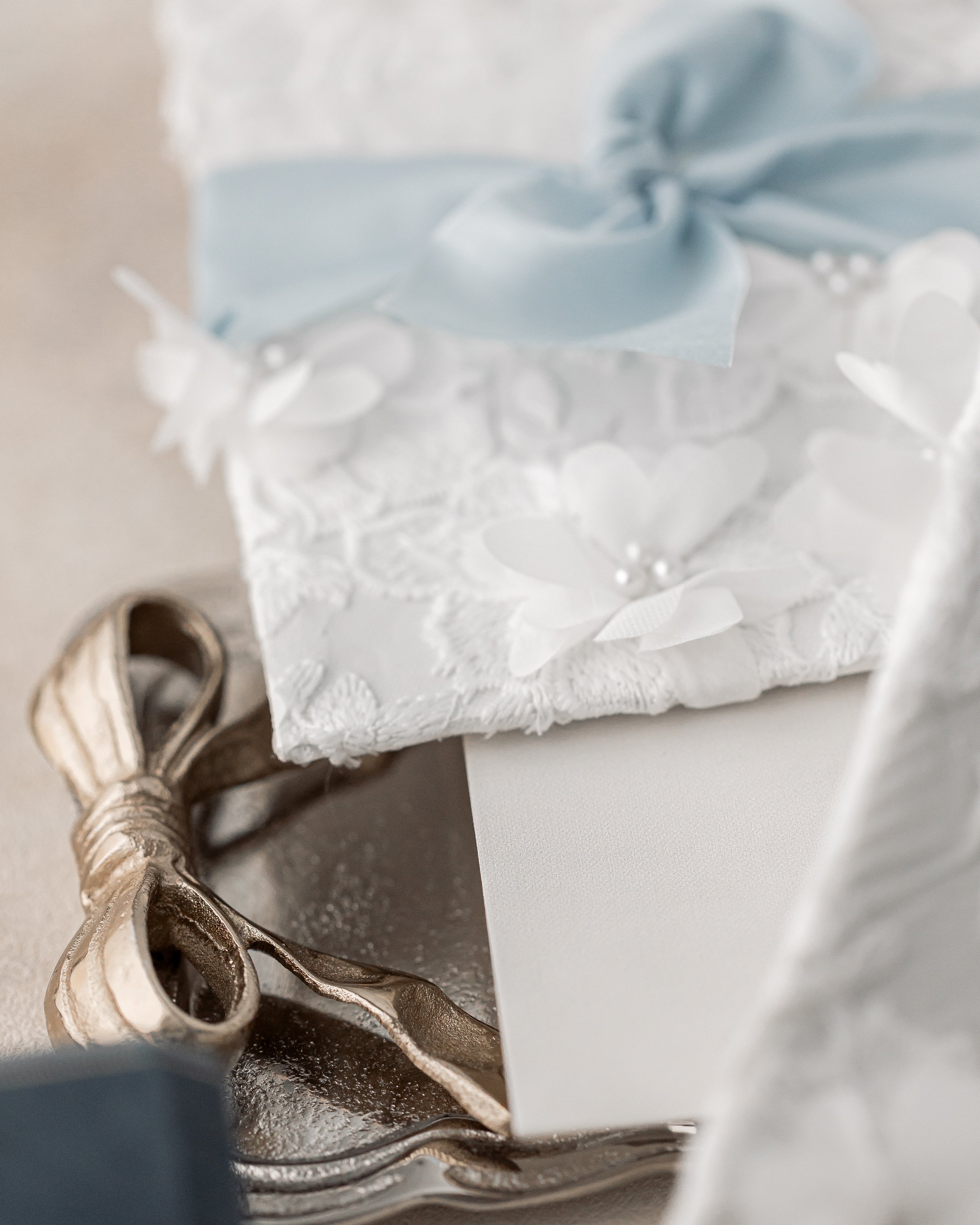 Sewn pearl stones add sparkle and texture, catching the light and emphasizing the suite’s tactile luxury.
