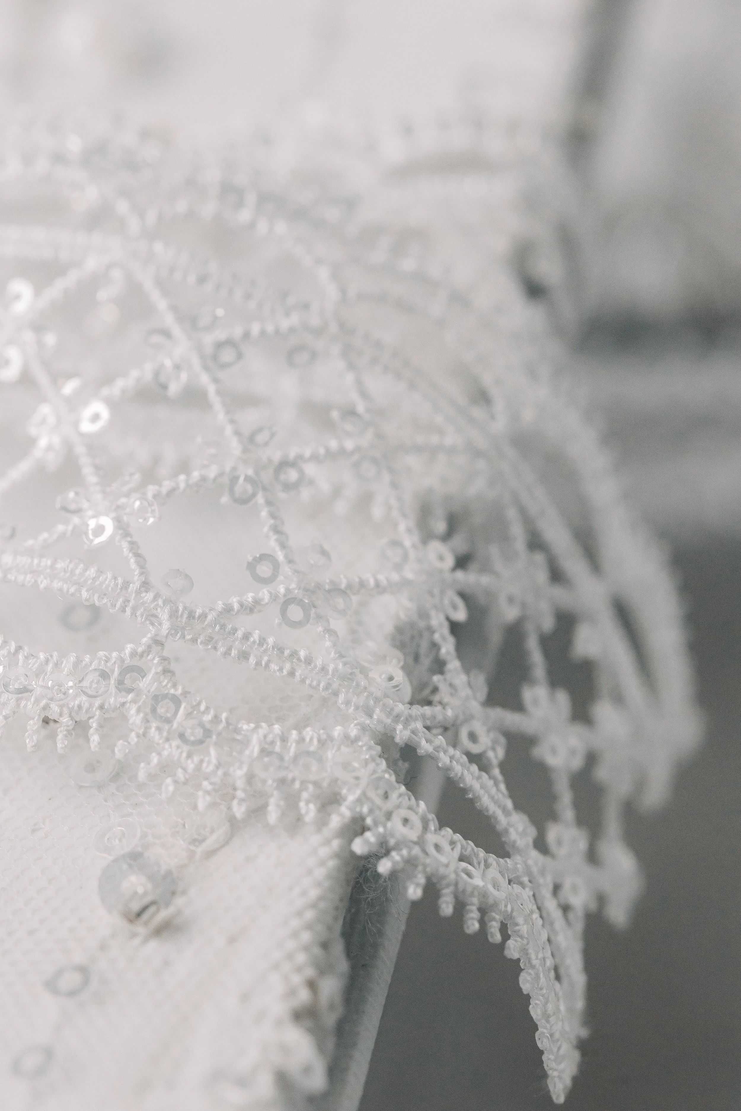 Matching ribbon hand-selected, sourced by NOTE, and individually tied for each invitation suite. 
