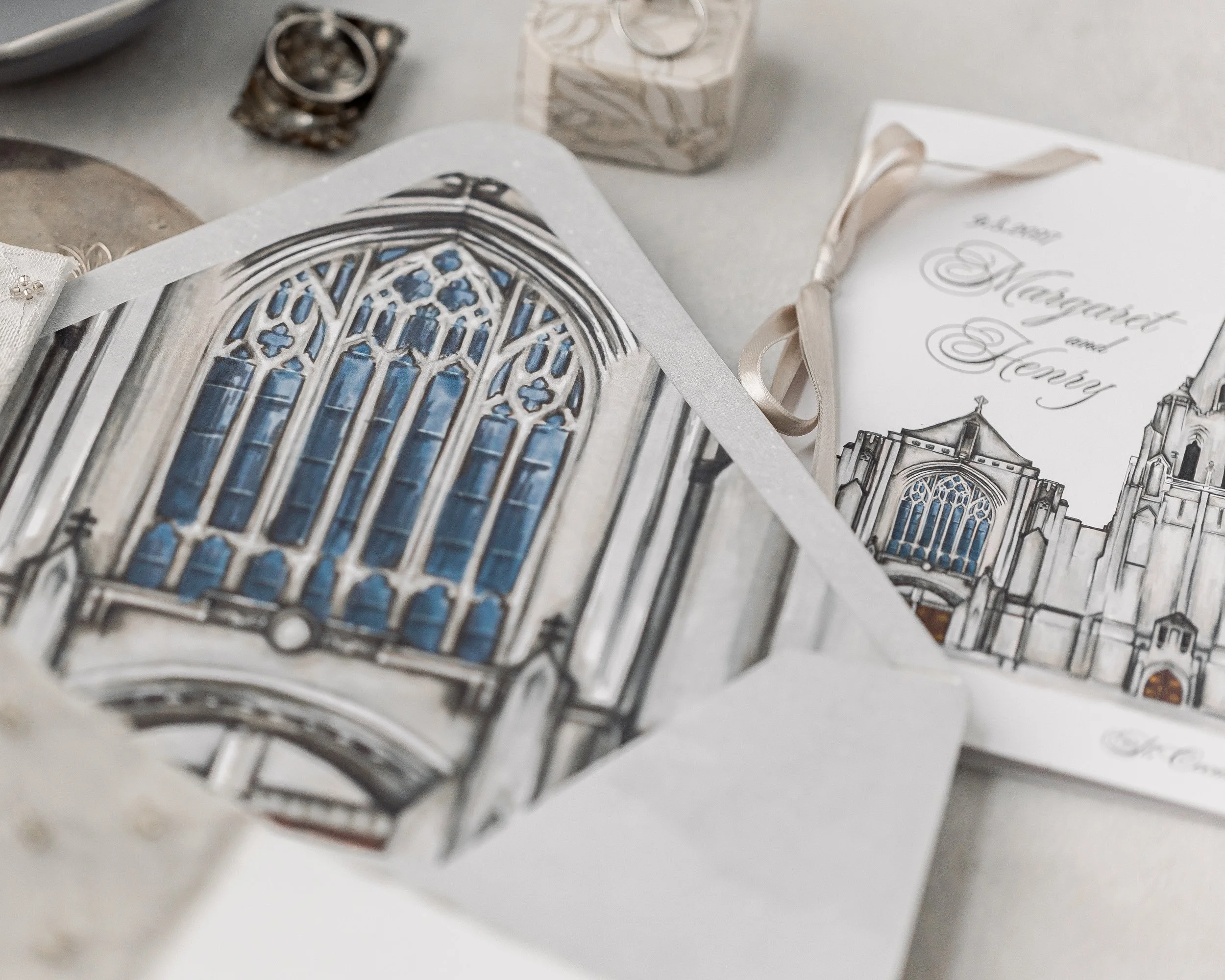 Hand-painted watercolor of St. Cecilia Church anchors the center of the invitation with quiet sophistication.