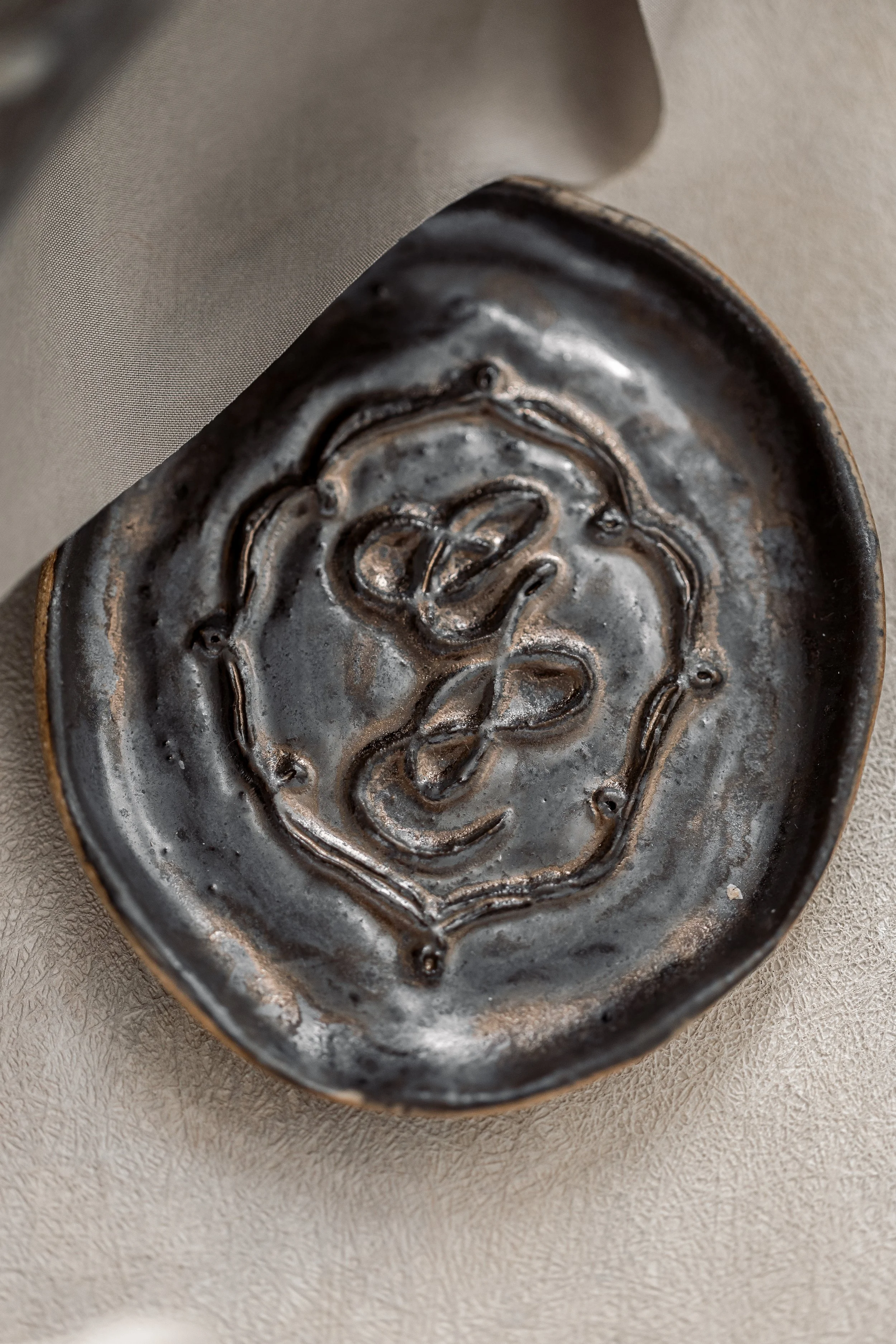 For the styling photos to really feel complete a ceramic ring dish matching the monogram and charm glaze color perfectly was handmade.