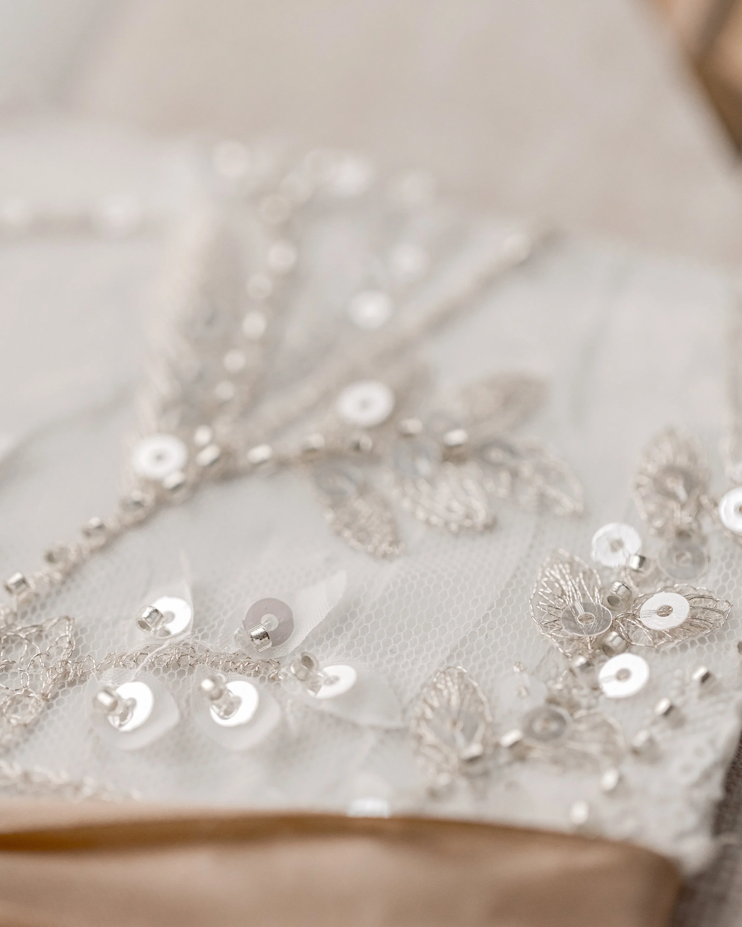 Several angles capture the clear sequins, champagne-gold embroidery, and fabric leaves, showcasing the suite’s depth, texture, and light-reflecting qualities.
