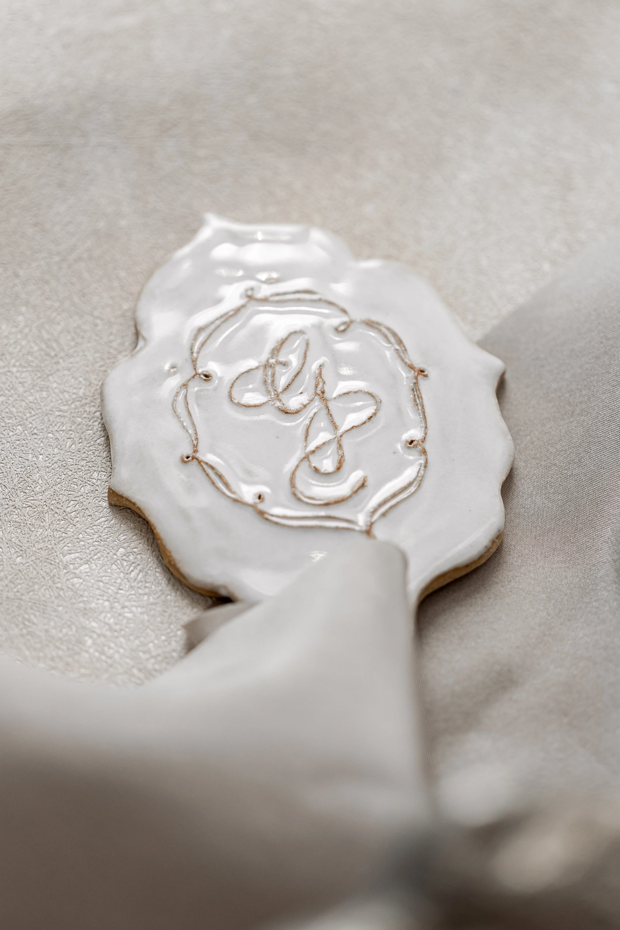 A cake charm with the couple's monogram carved relief-style created cohesion across every aspect of the event.