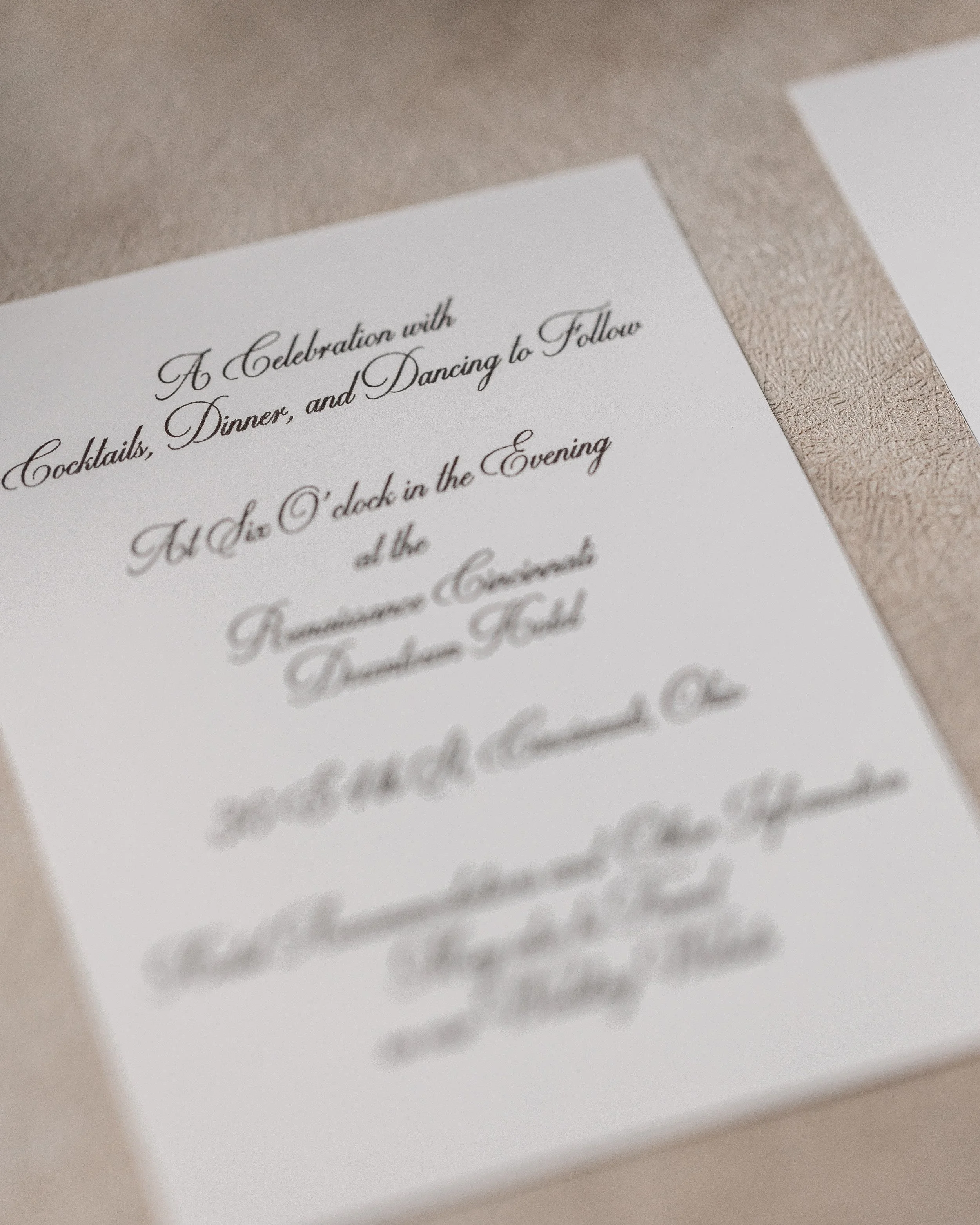 A complementary informational card, printed in black digital ink on matching cardstock, provides details for dinner and dancing, echoing the typographic and metallic design elements of the suite.