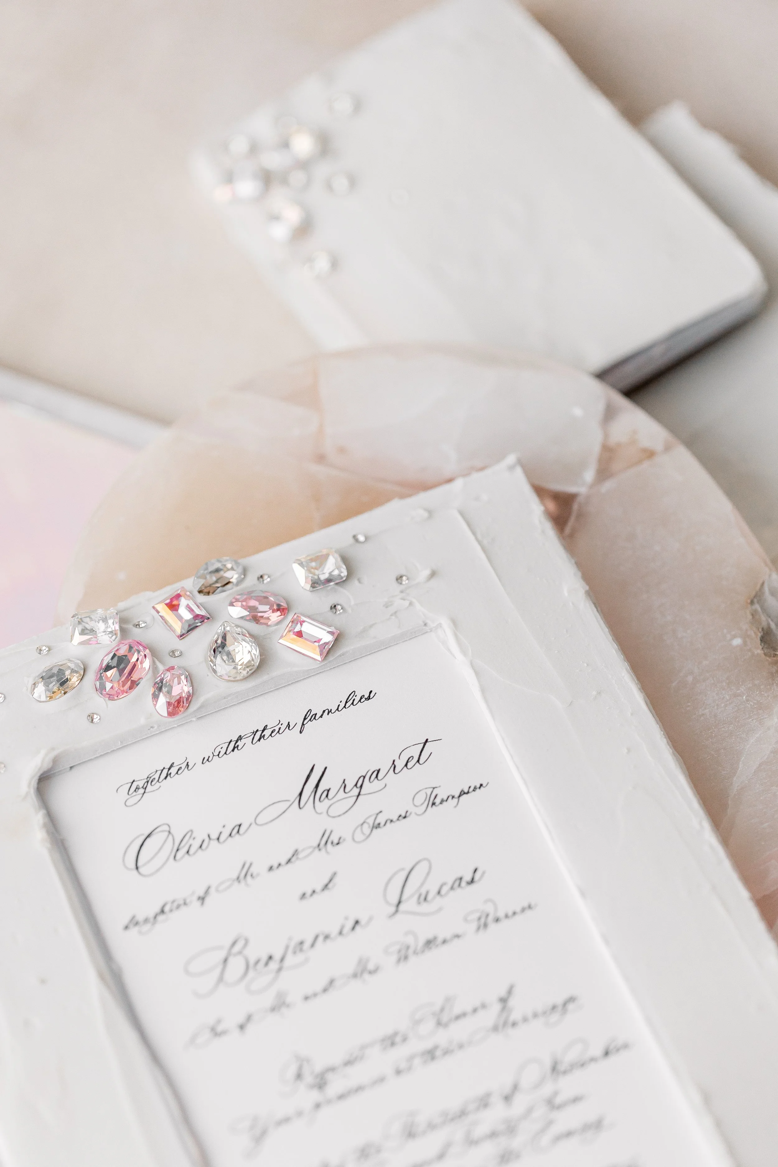 Crisp digital printing paired with elegant full-script calligraphy shines beneath the matte overlay, balancing sparkle and refinement.