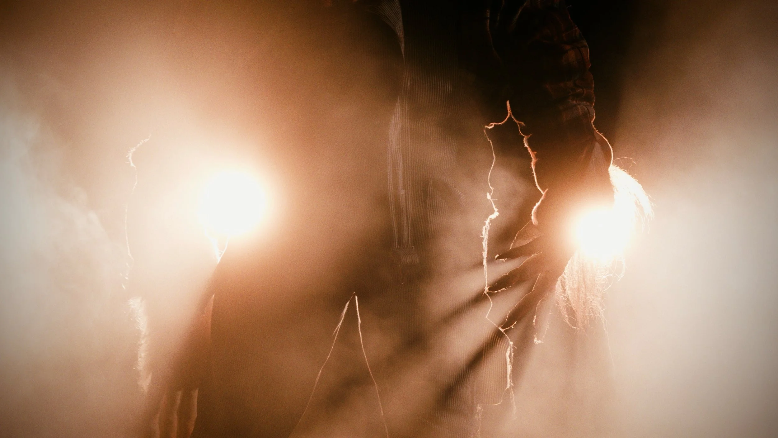 A monster's claw, backlit by intense in the image.