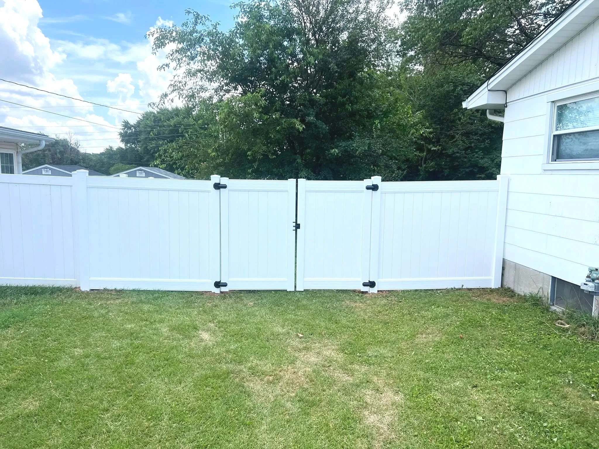 White vinyl fence with privacy gate