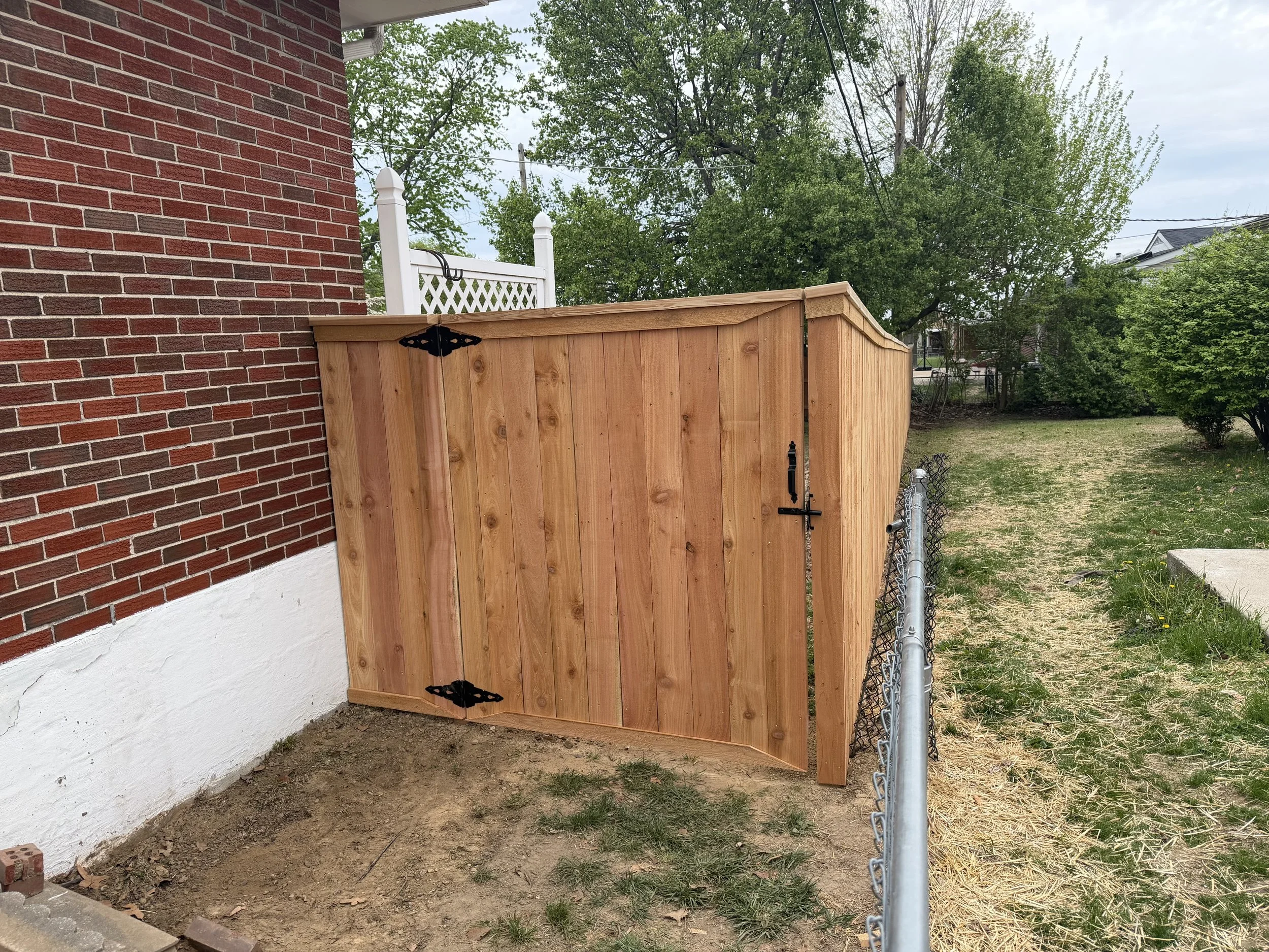 Cedar VS Pressure Treated Fence: Which is Better for Missouri Homeowners