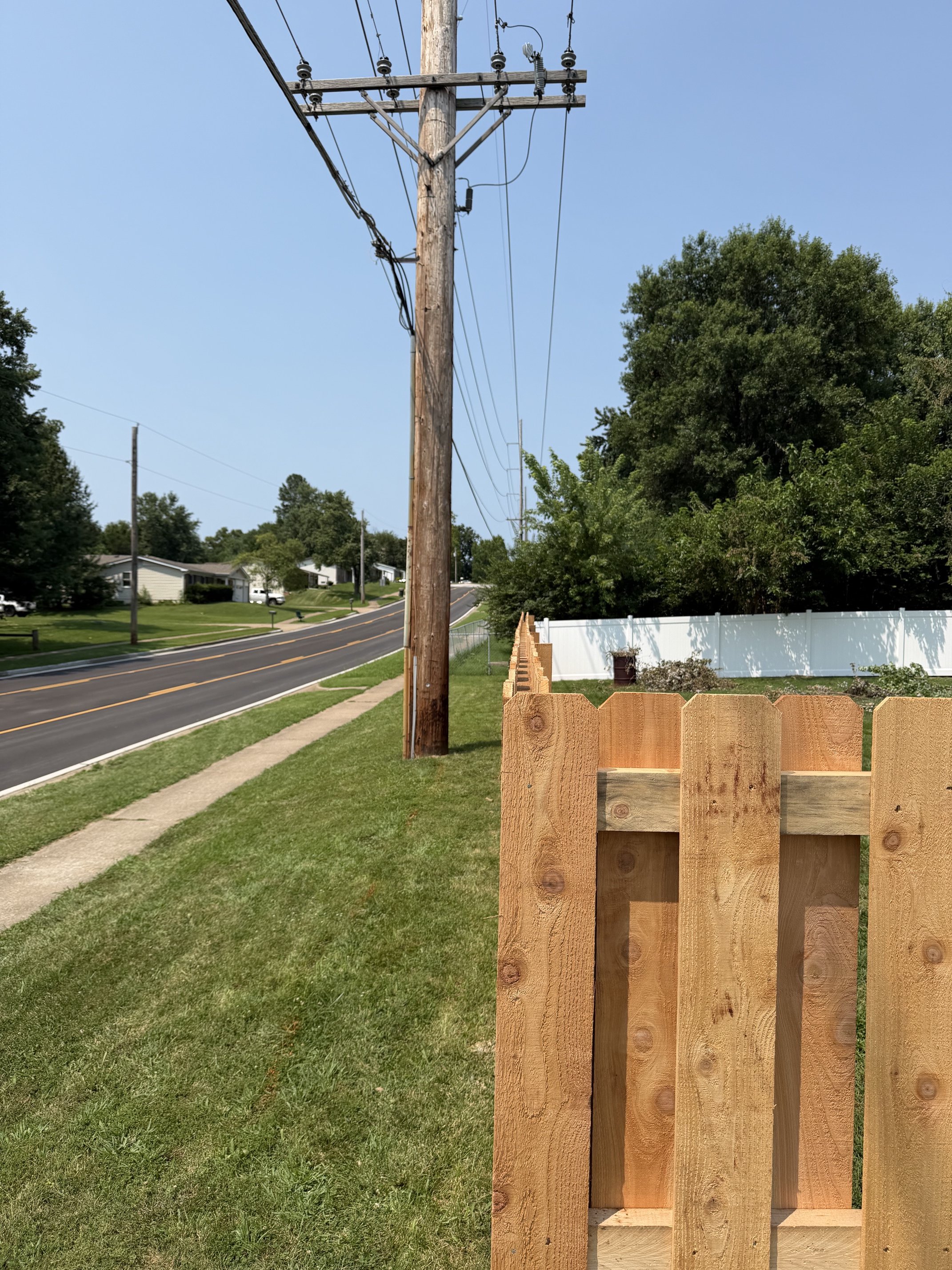 Straight line on a cedar shadowbox fence in St. Charles, MO
