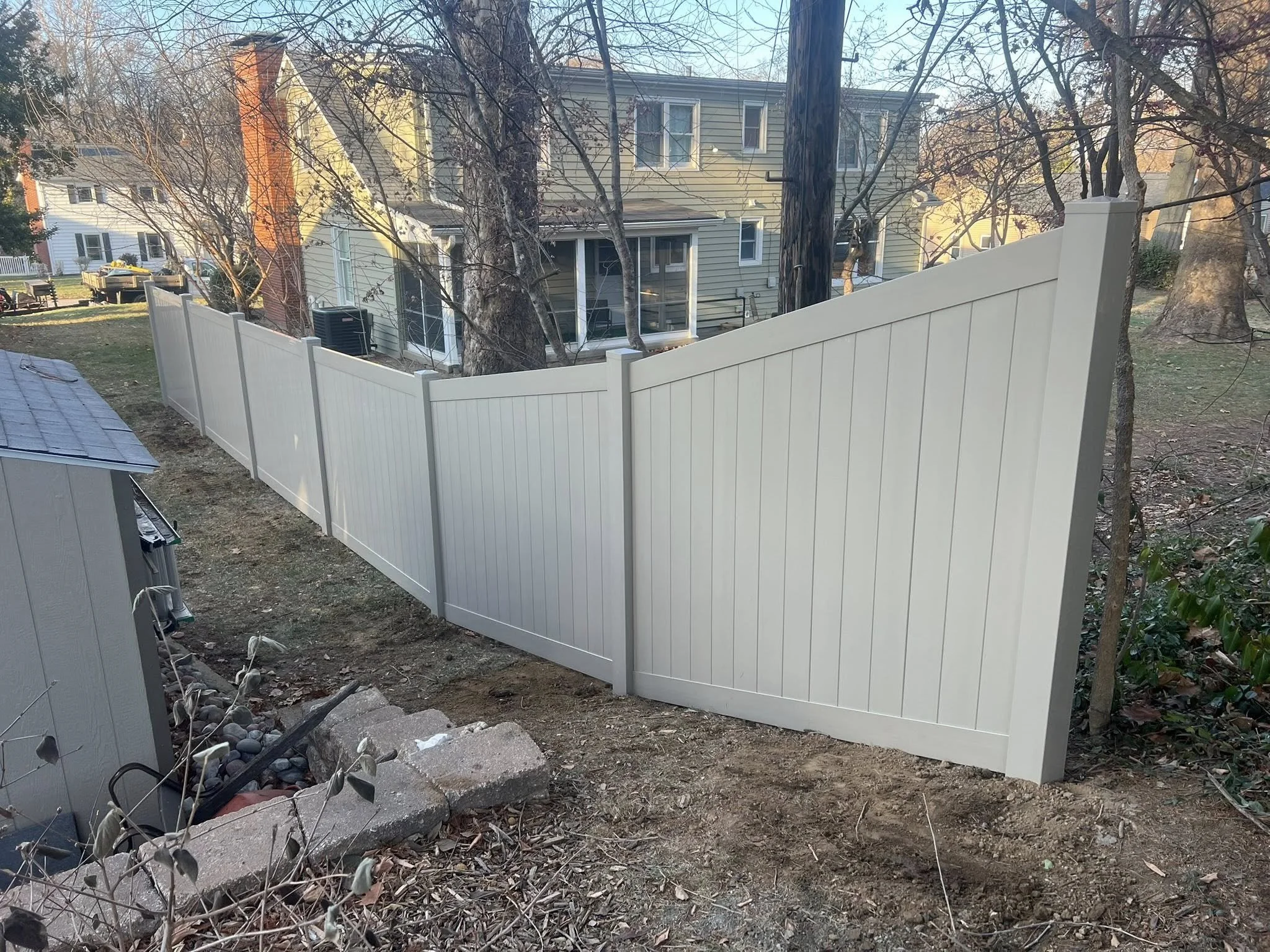 light brown privacy vinyl fence in backyard - Midwest Fence