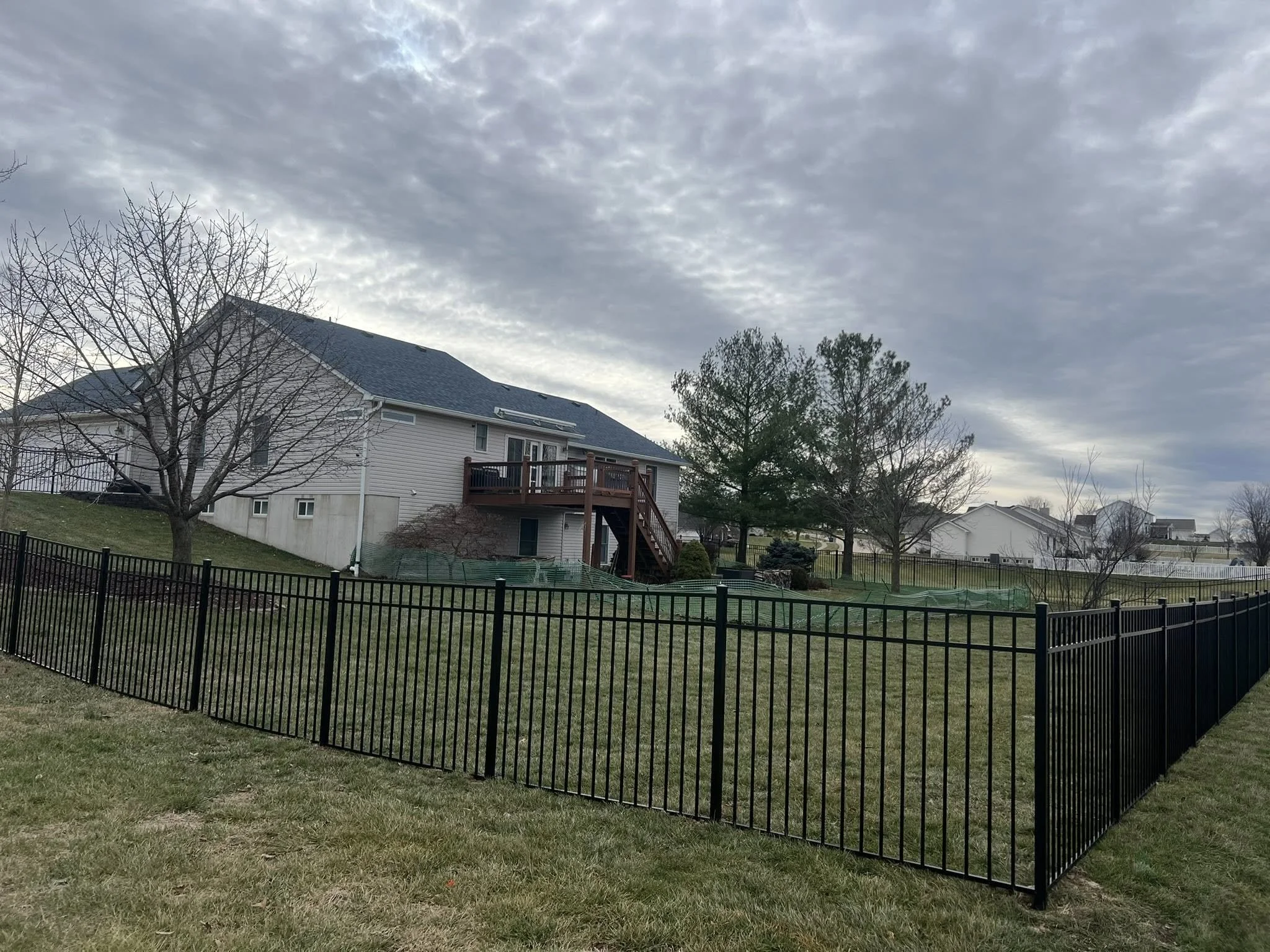 black ornamental aluminum fence in backyard - Midwest Fence