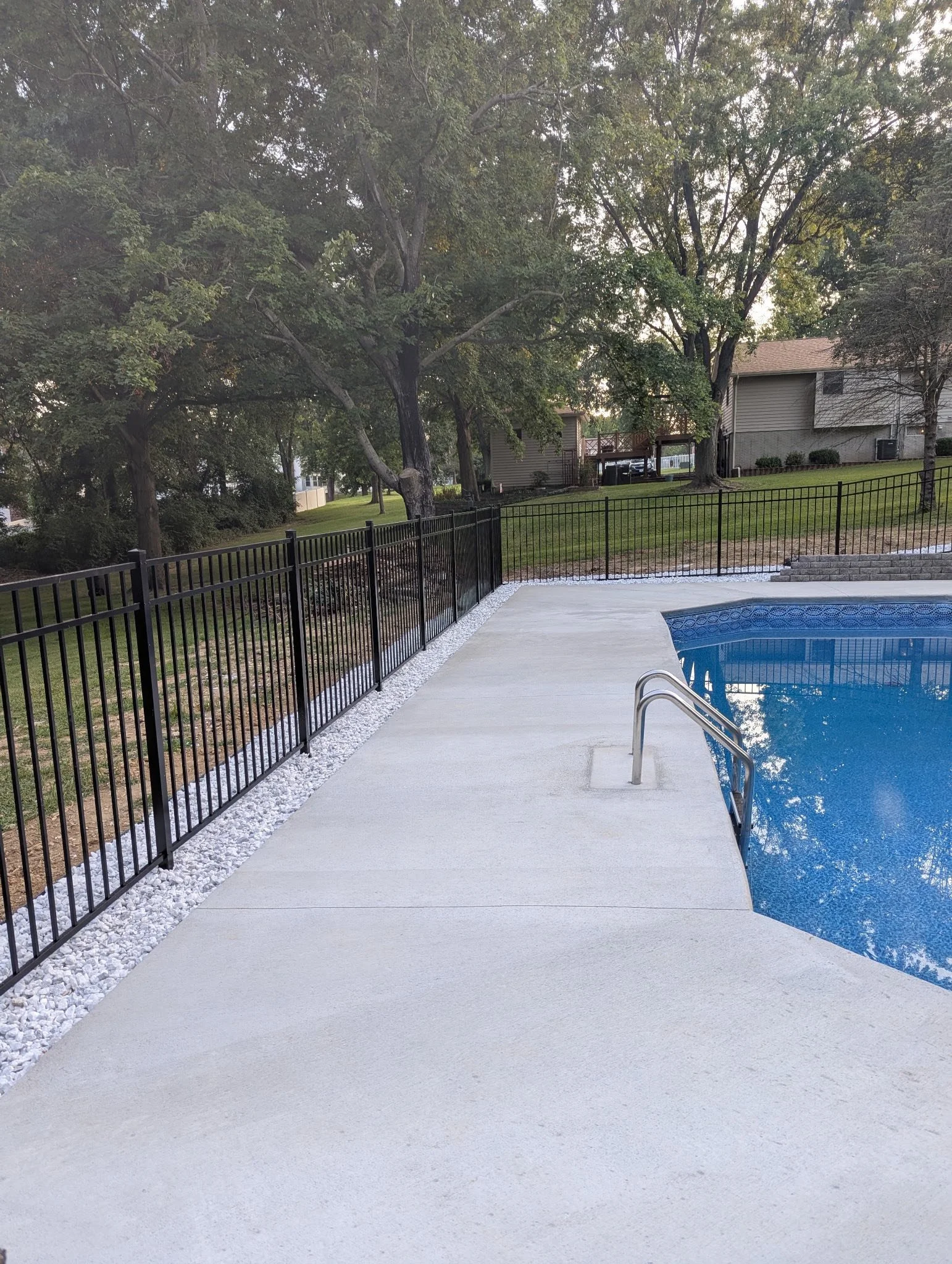 black ornamental aluminum fence around a pool - Midwest Fence
