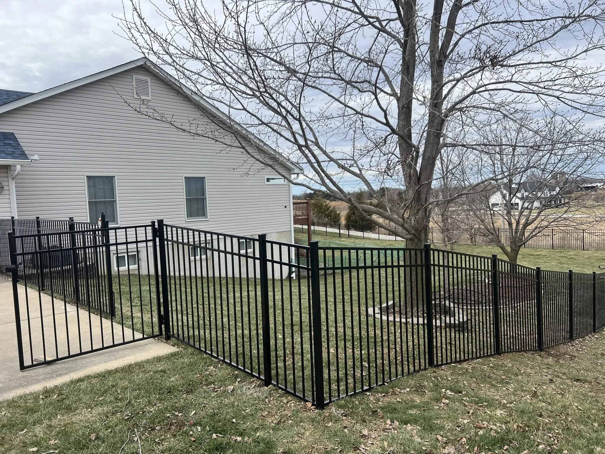 black ornamental aluminum fence in backyard - Midwest Fence