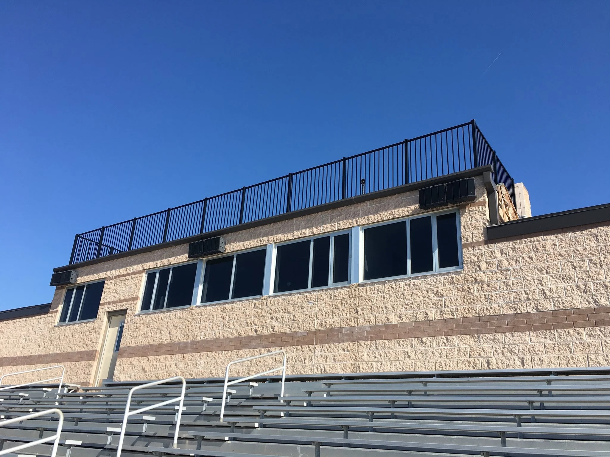 black ornamental aluminum fence on top of stadium - Midwest Fence