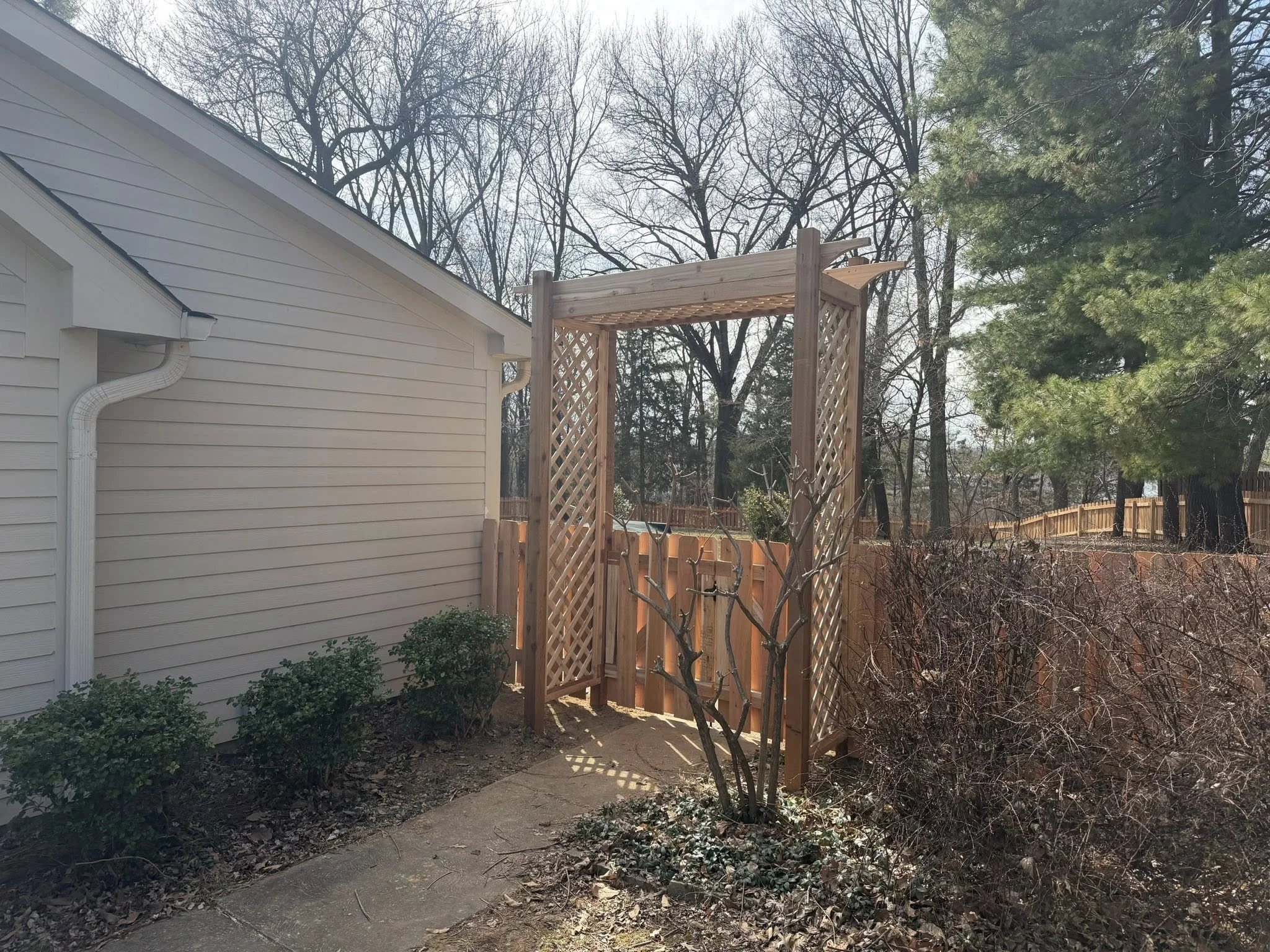 Cedar wood fence gate with arbor pergola - Midwest Fence