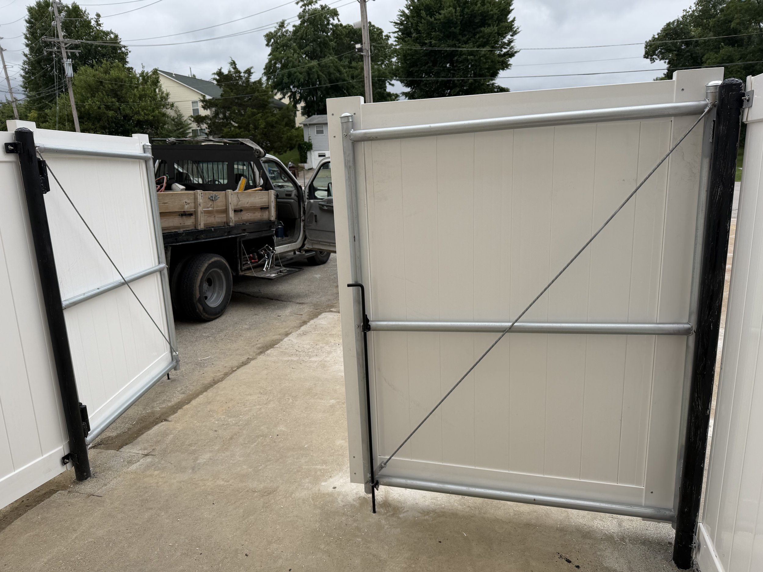 Reinforced gate frame on a commercial trash enclosure