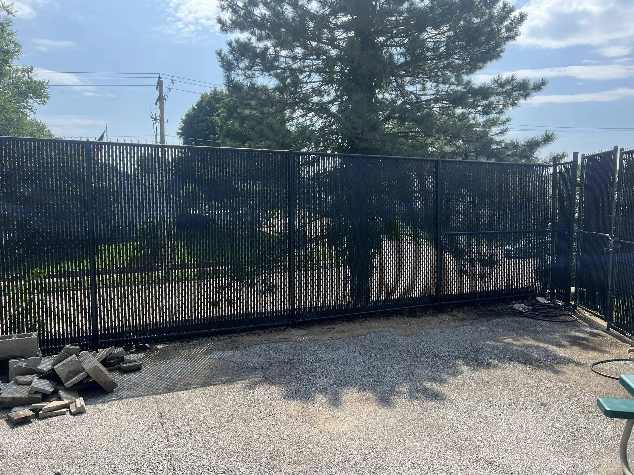 black chain link fence with privacy slats
