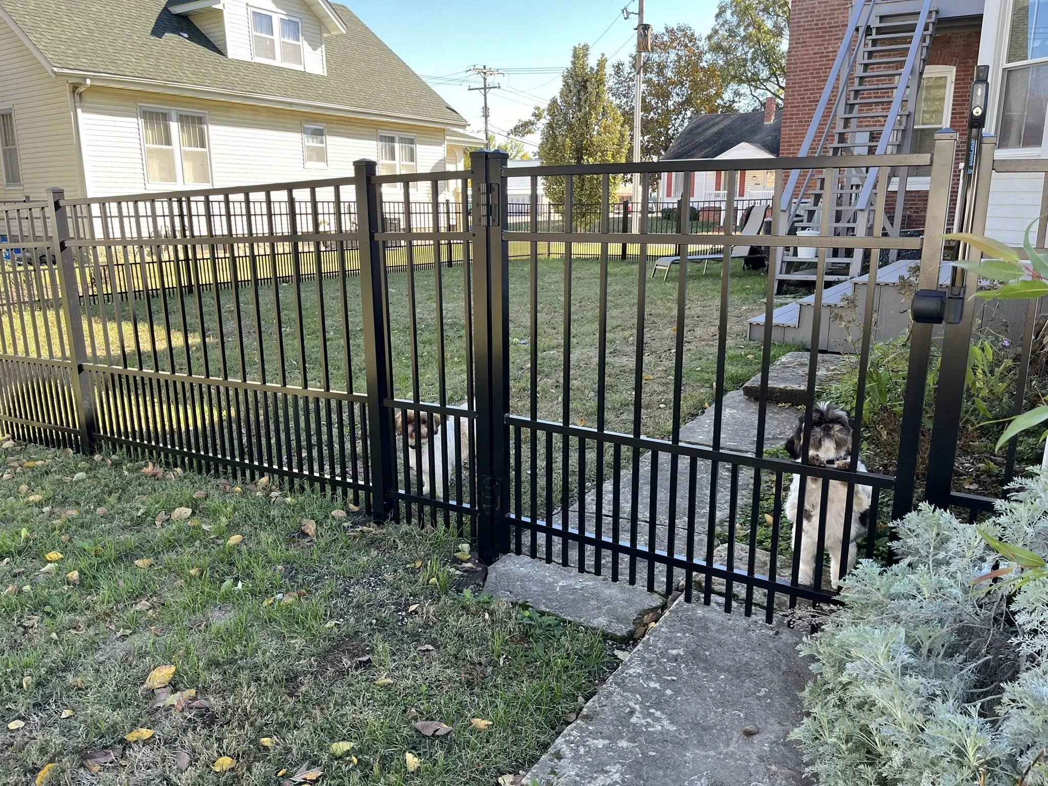 black ornamental aluminum fence in backyard - Midwest Fence