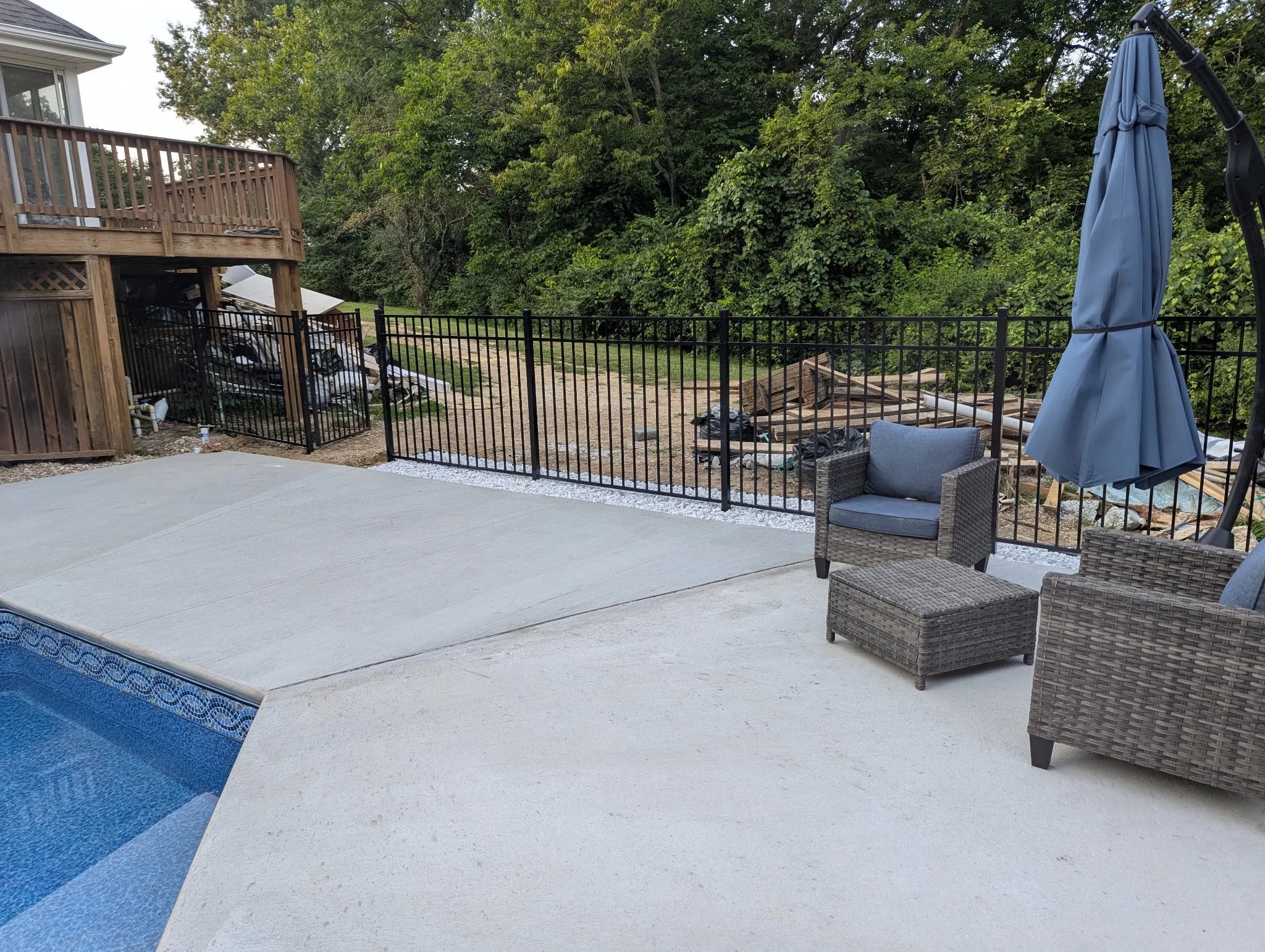 black ornamental aluminum fence around pool - Midwest Fence