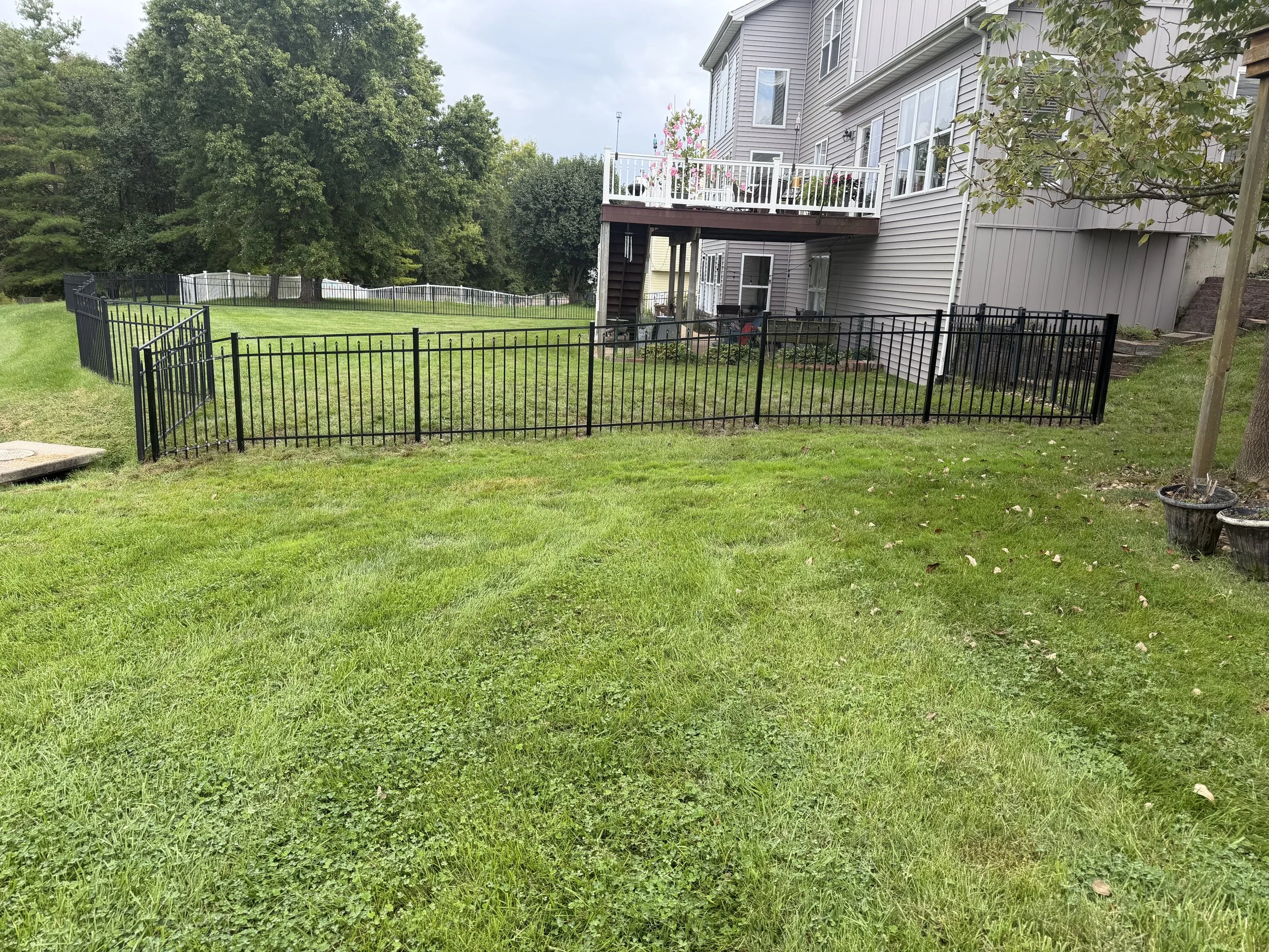Black three-rail aluminum fence in St. Charles, Missouri built by Midwest Fence
