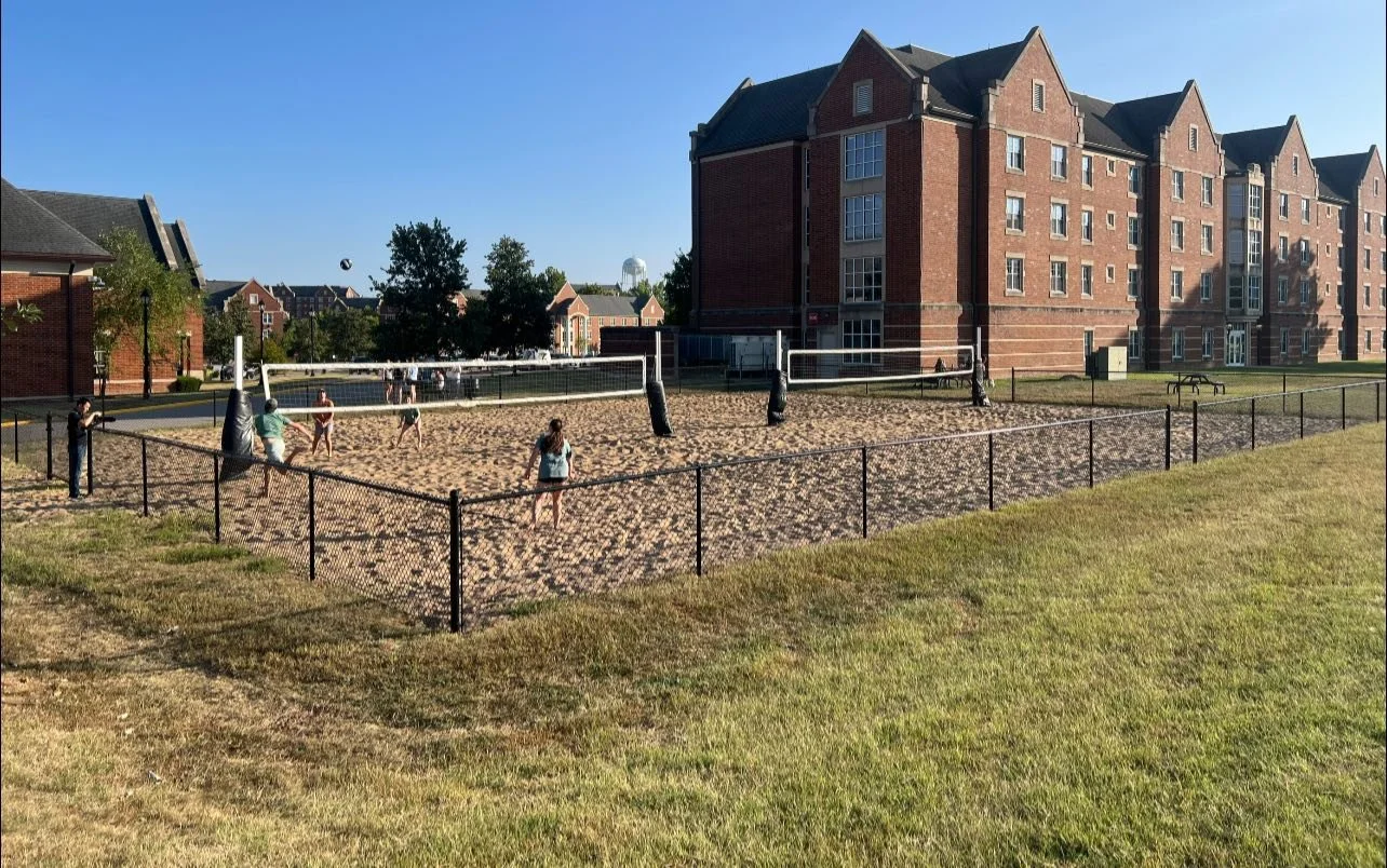 black chain link fence around sand volleyball courts at Lindenwood University