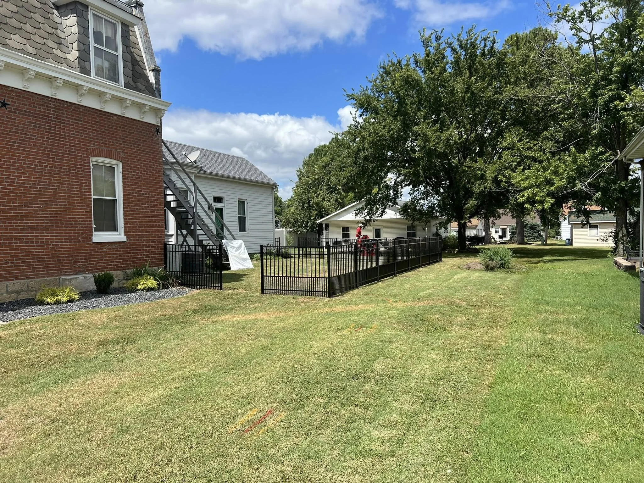 black ornamental aluminum fence in backyard - Midwest Fence