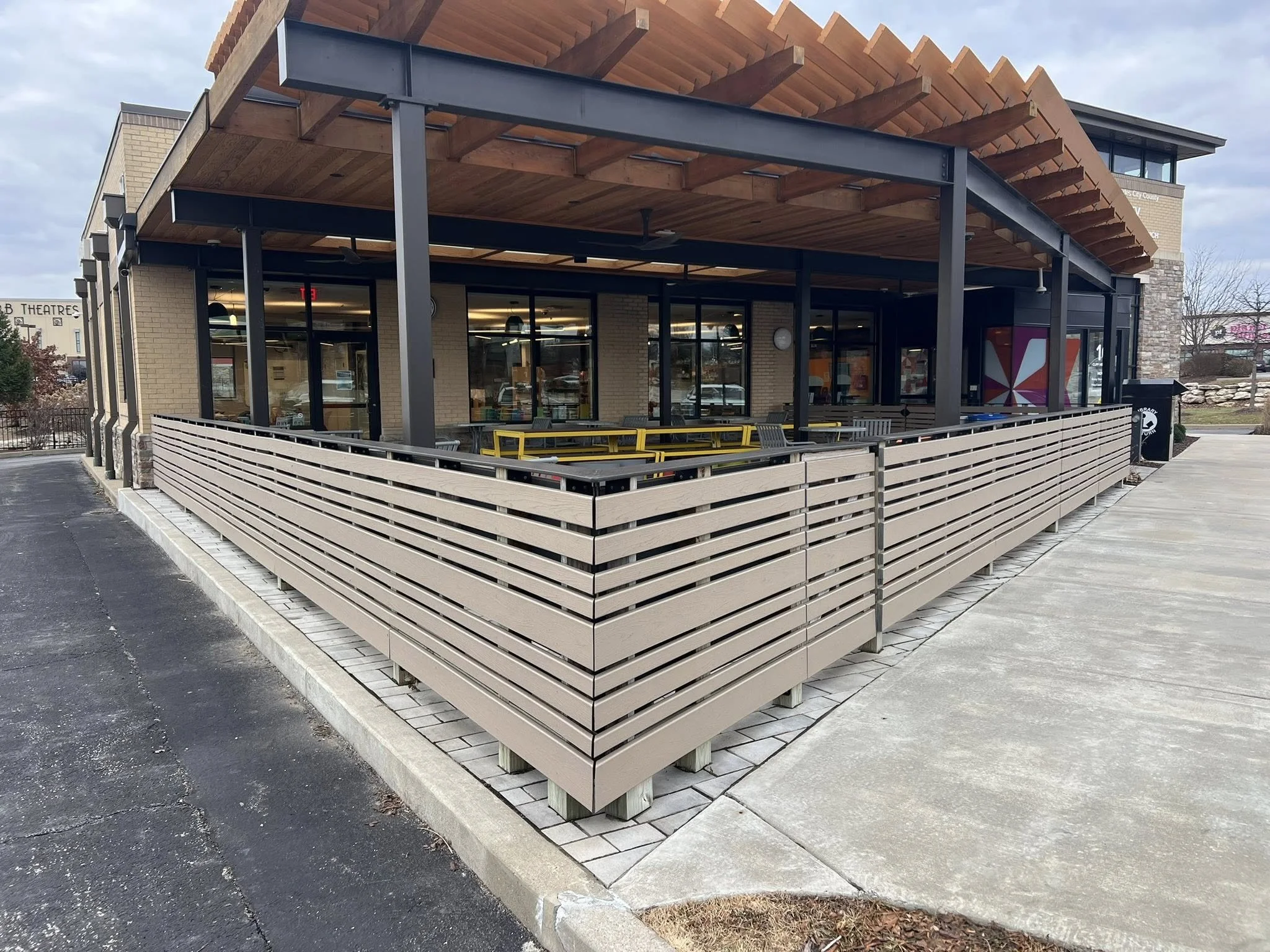 light brown horizontal composite around restaurant patio - Midwest Fence