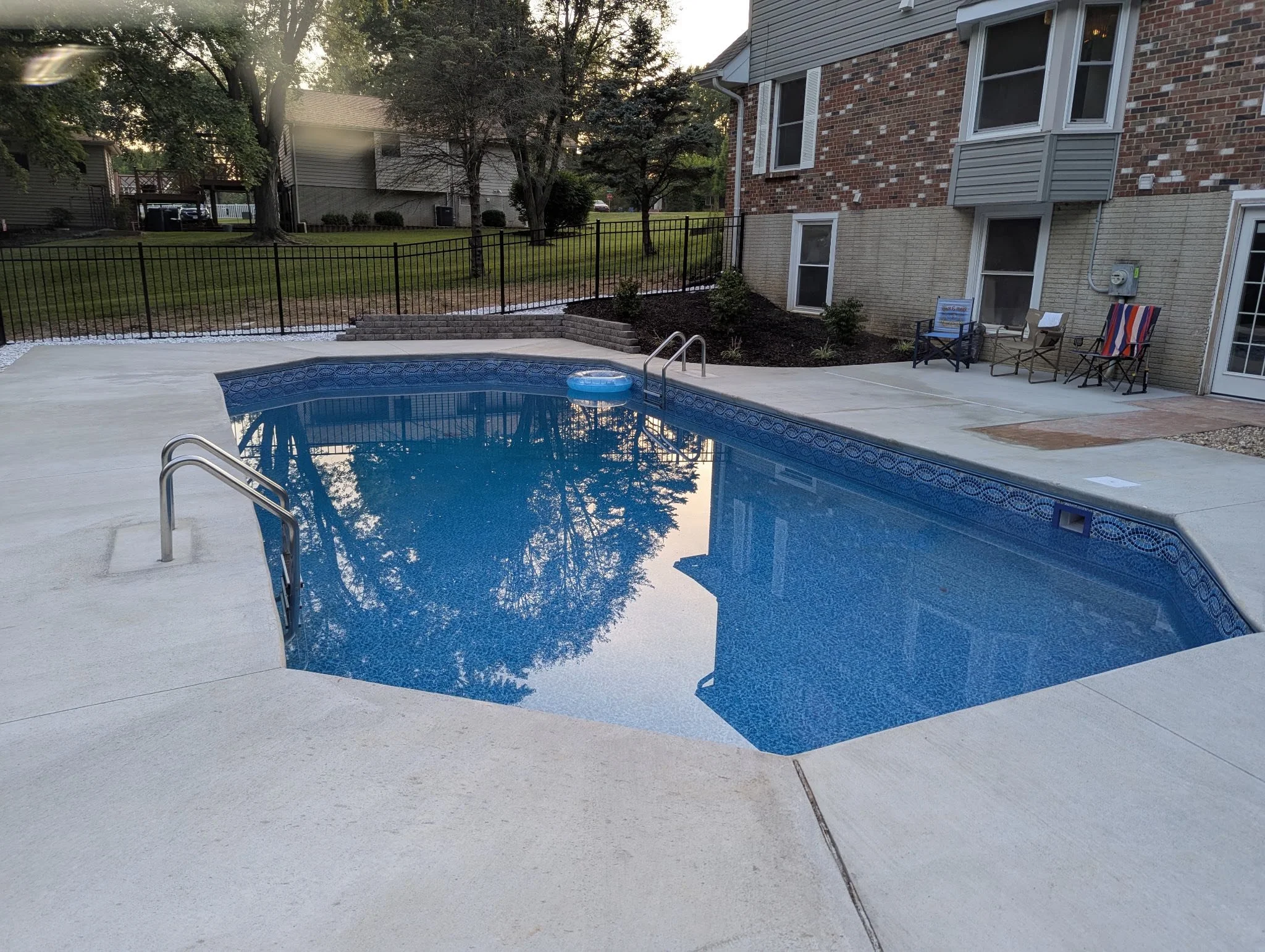 black ornamental aluminum fence around pool - Midwest Fence