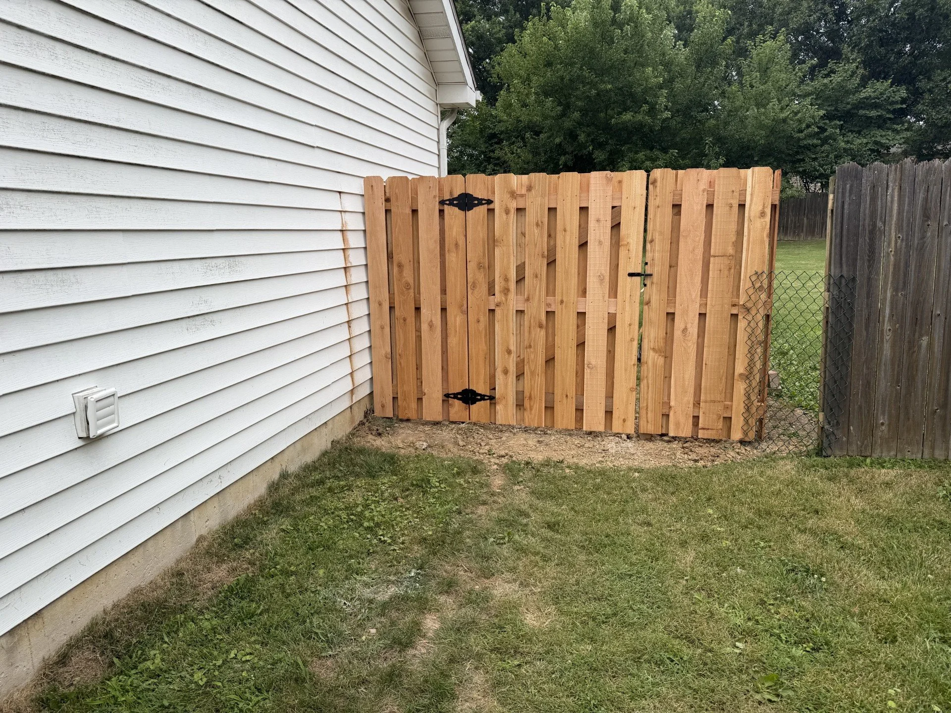 Custom cedar shadowbox privacy fence and wood gate installed in St. Charles, Missouri