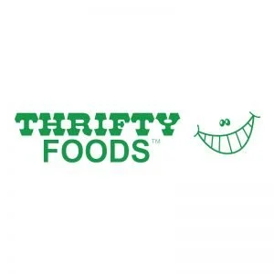Thrifty Foods logo with a smiling face illustration