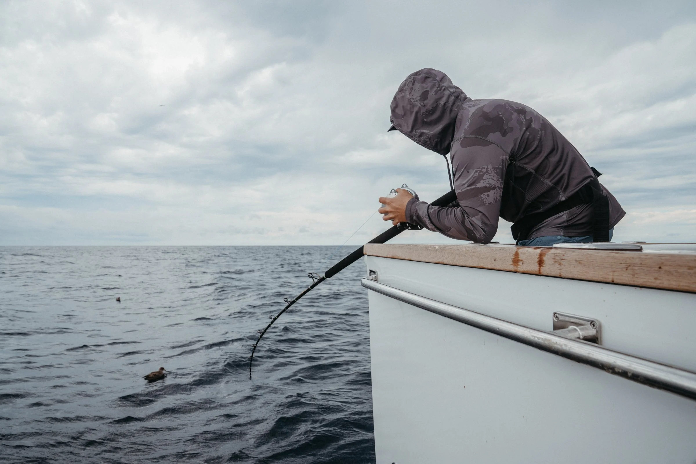 Pelagic's Brandon Cotton, taking it to the rail on the first of two big yellowfin.