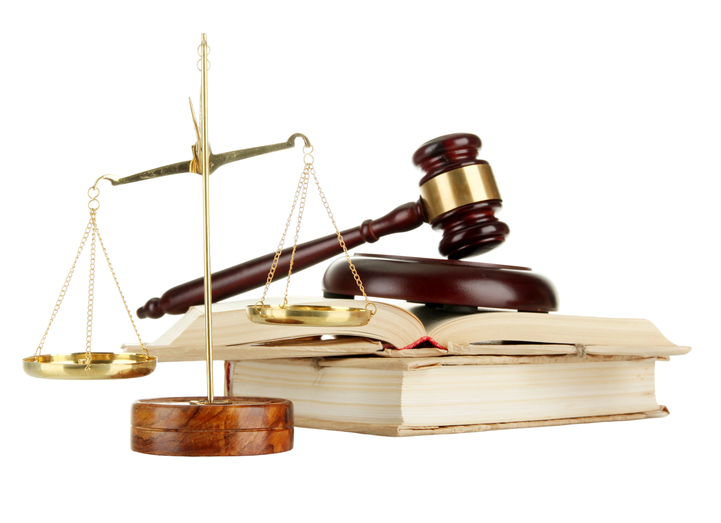 A judge's gavel, a scale of justice, and legal books on a wooden surface.