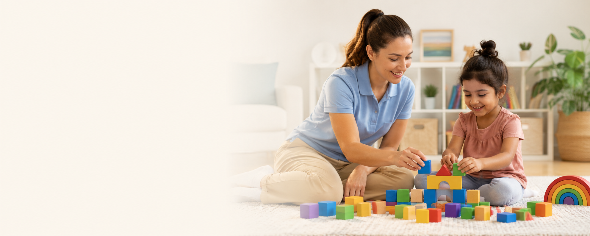 A woman and a young girl playing with colorful wooden building blocks on a white carpet in a living room with bookshelf and plants in the background.