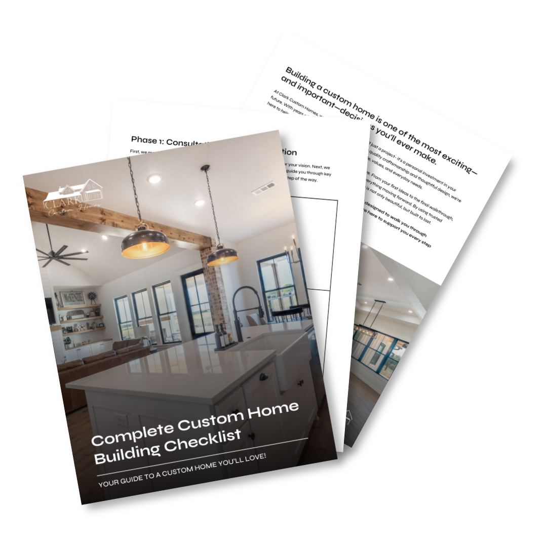 Cover page of a guide titled 'Complete Custom Home Building Checklist' featuring a modern kitchen with white countertops, a farmhouse sink, exposed brick, and hanging pendant lights.