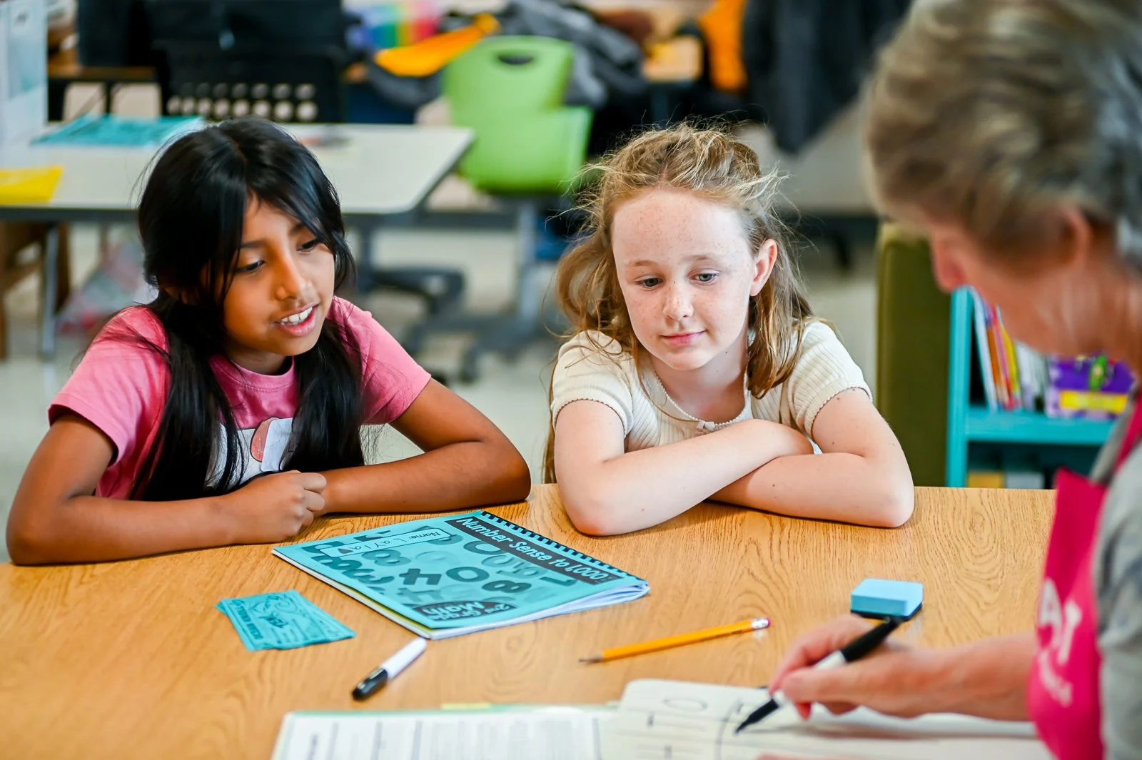 volunteer doing math tutoring for elementary school students